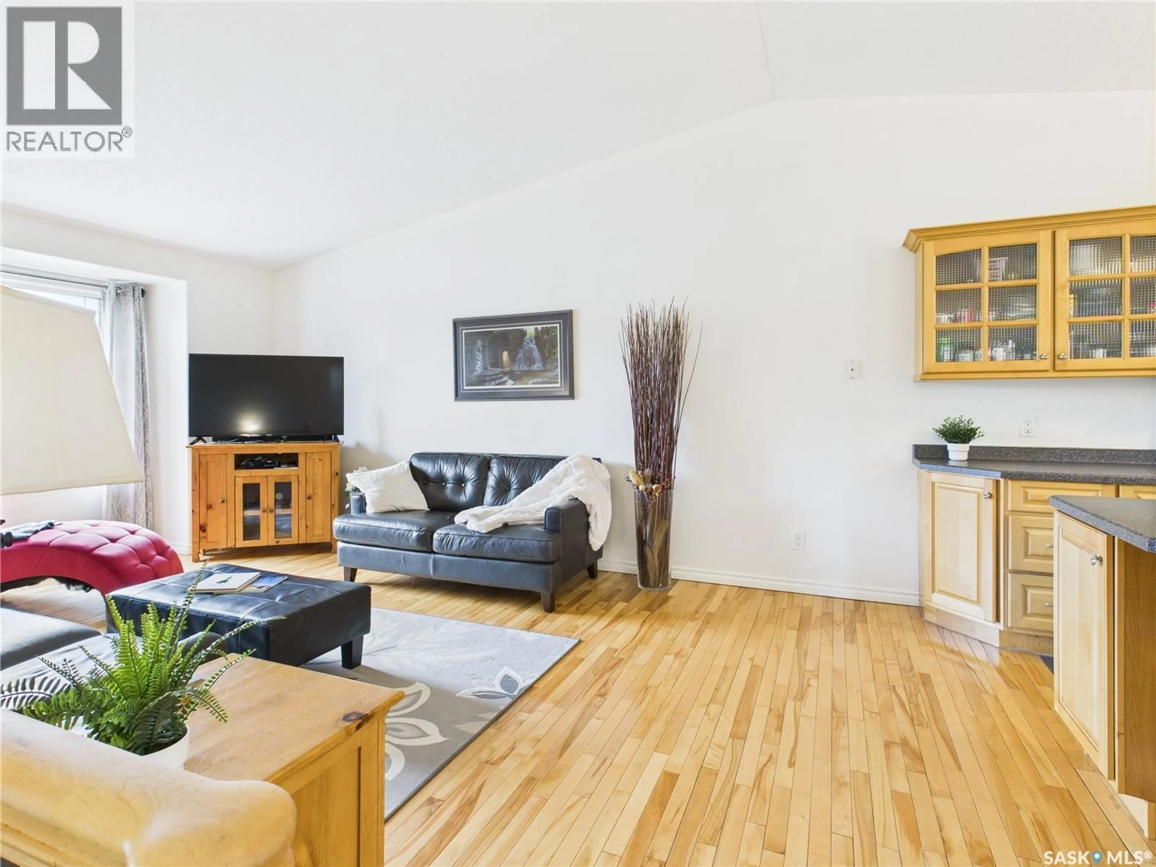 Living room with furniture, wood/laminate floor for 615 CASEY ROAD, Prince Albert Saskatchewan S6V8C9