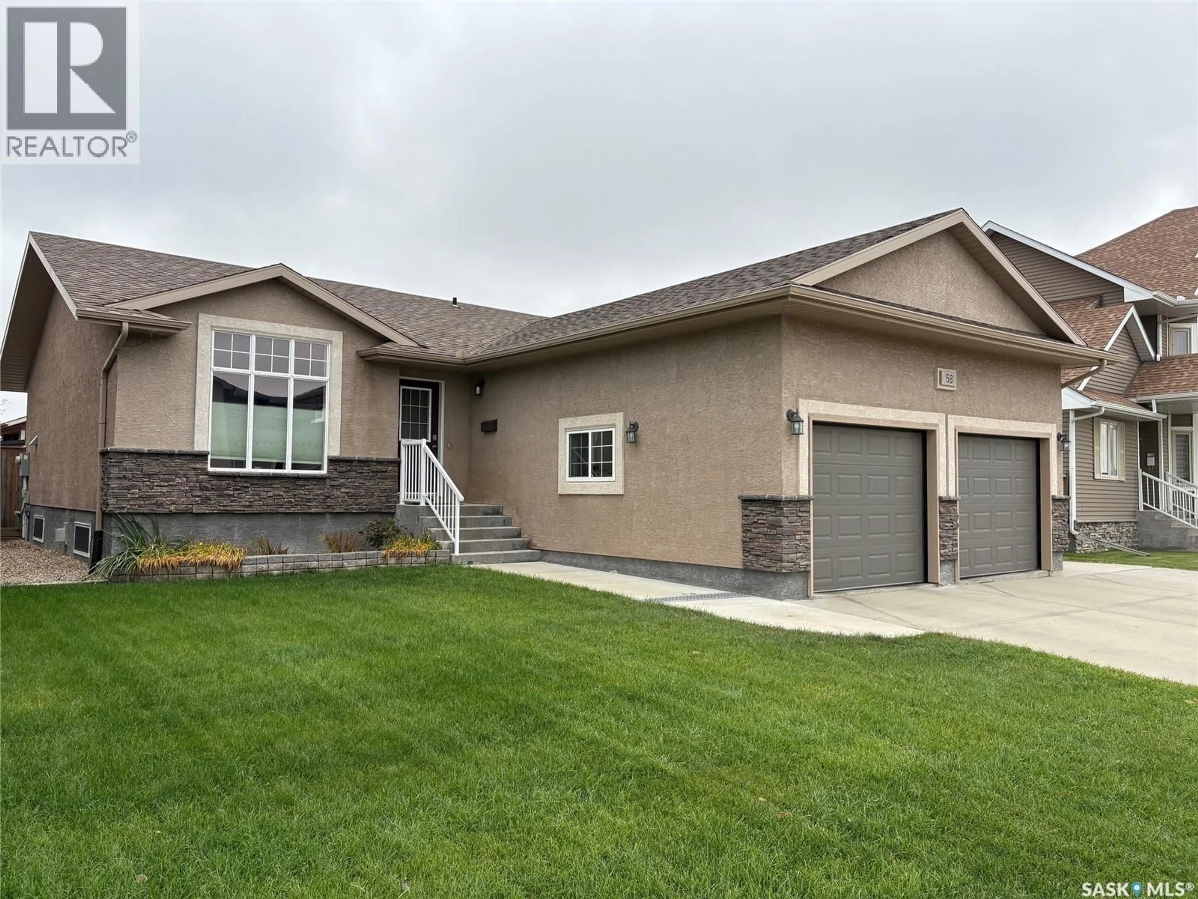 Home with vinyl exterior material, street for 58 WHITESAND DRIVE, Yorkton Saskatchewan S3N0E6