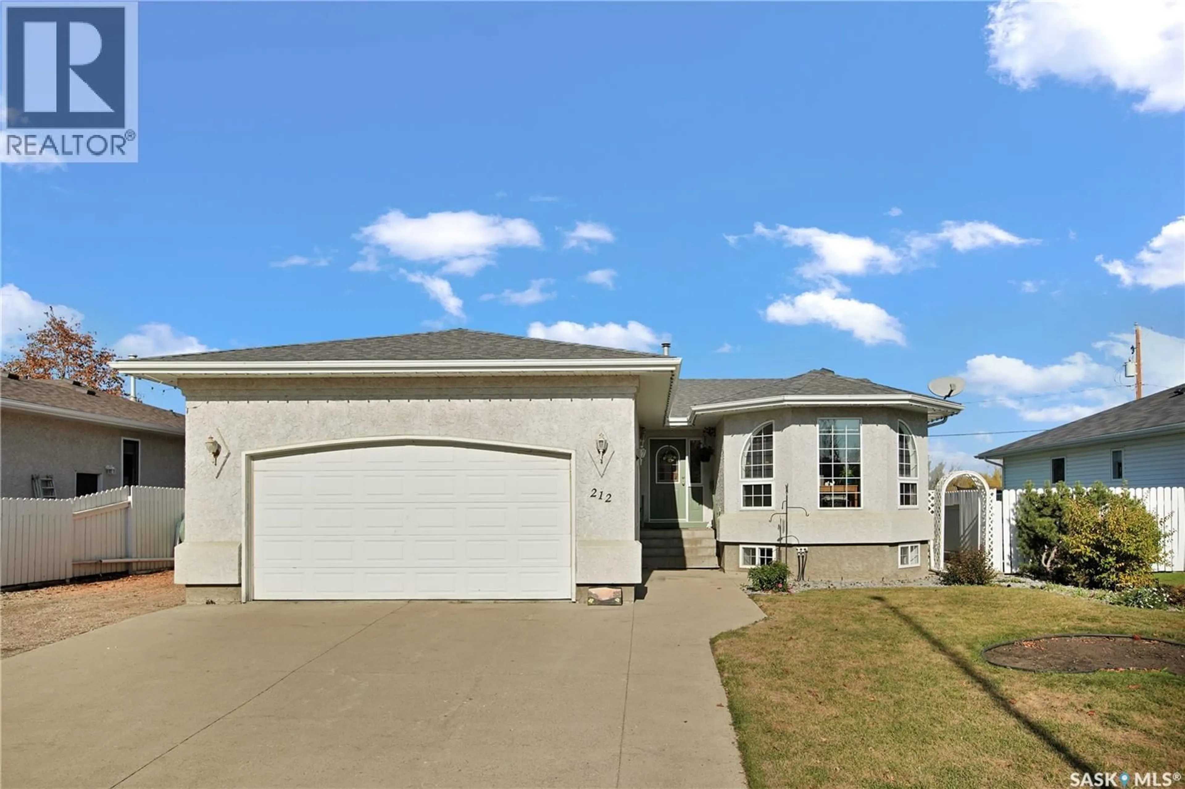 Home with vinyl exterior material, street for 212 WILLOW DRIVE, Osler Saskatchewan S0K3A0