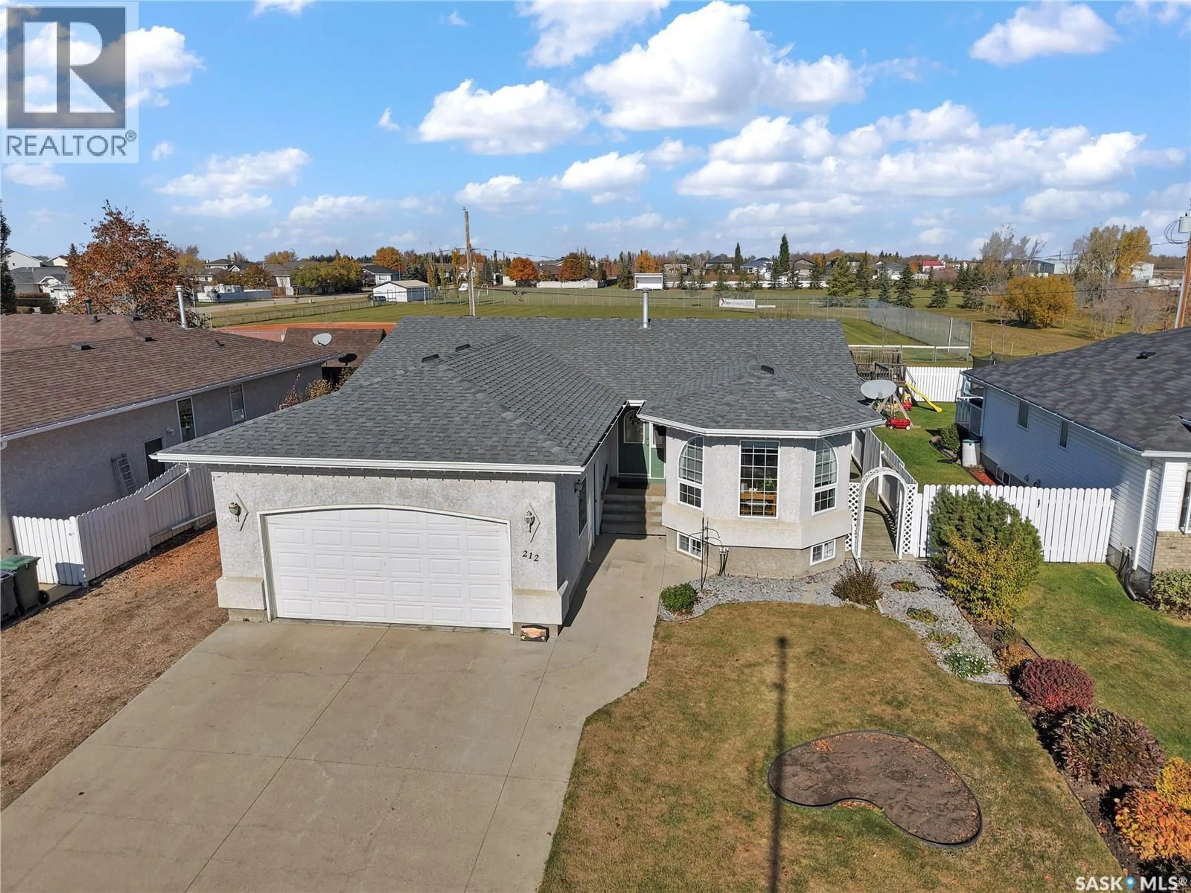 A pic from outside/outdoor area/front of a property/back of a property/a pic from drone, water/lake/river/ocean view for 212 WILLOW DRIVE, Osler Saskatchewan S0K3A0