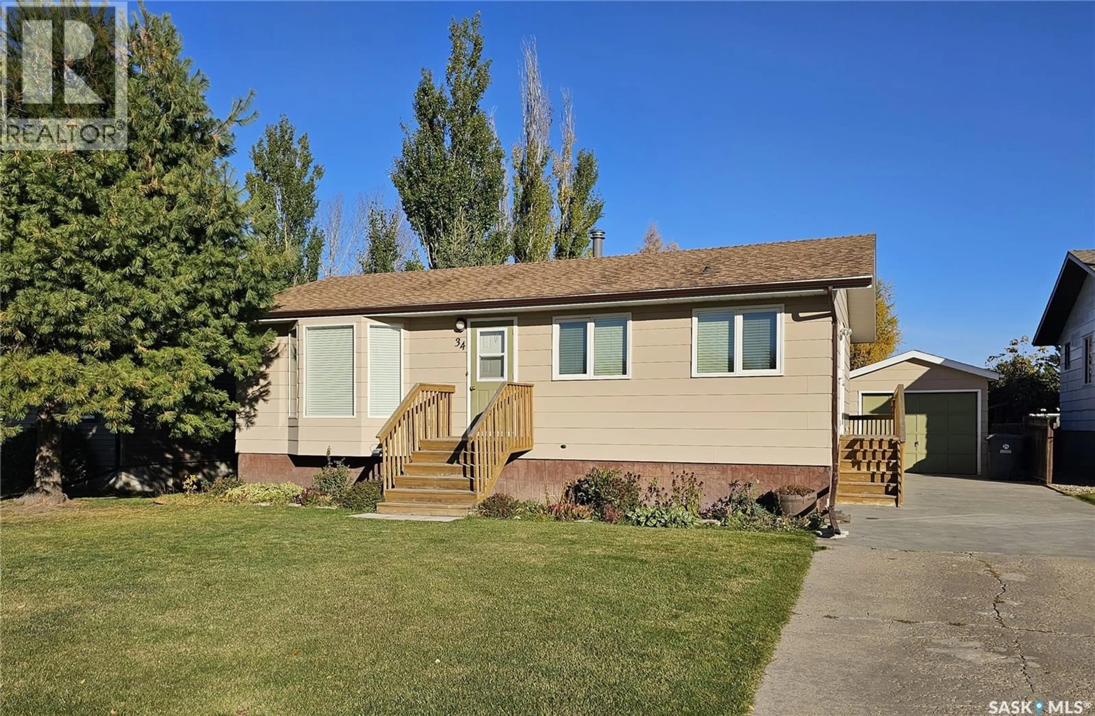 Home with vinyl exterior material, street for 34 STACK CRESCENT, Meadow Lake Saskatchewan S9X1B6