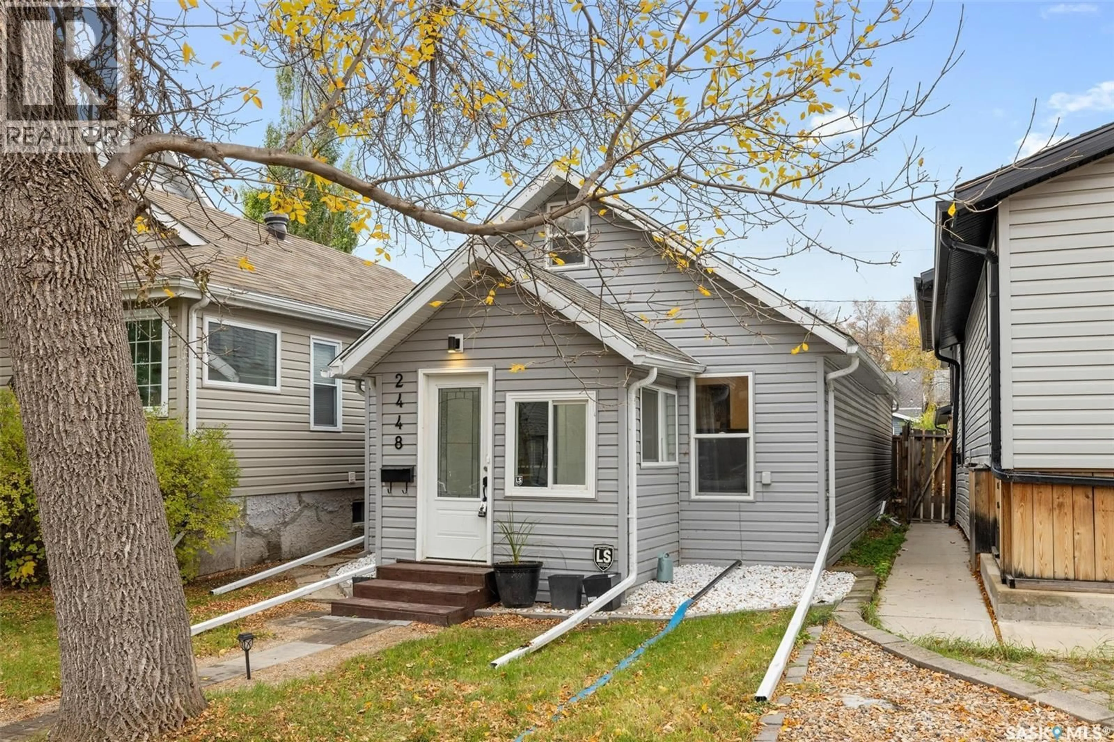 Home with vinyl exterior material, street for 2448 ATKINSON STREET, Regina Saskatchewan S4N3X5