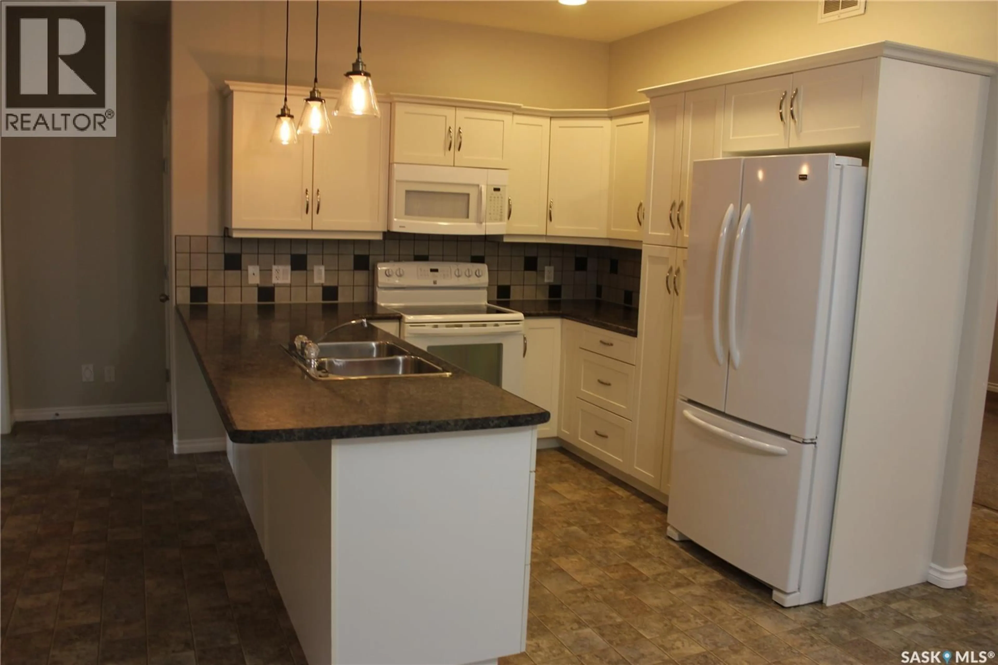 Standard kitchen, ceramic/tile floor for 106 ERICKSON STREET, Midale Saskatchewan S0C1S0