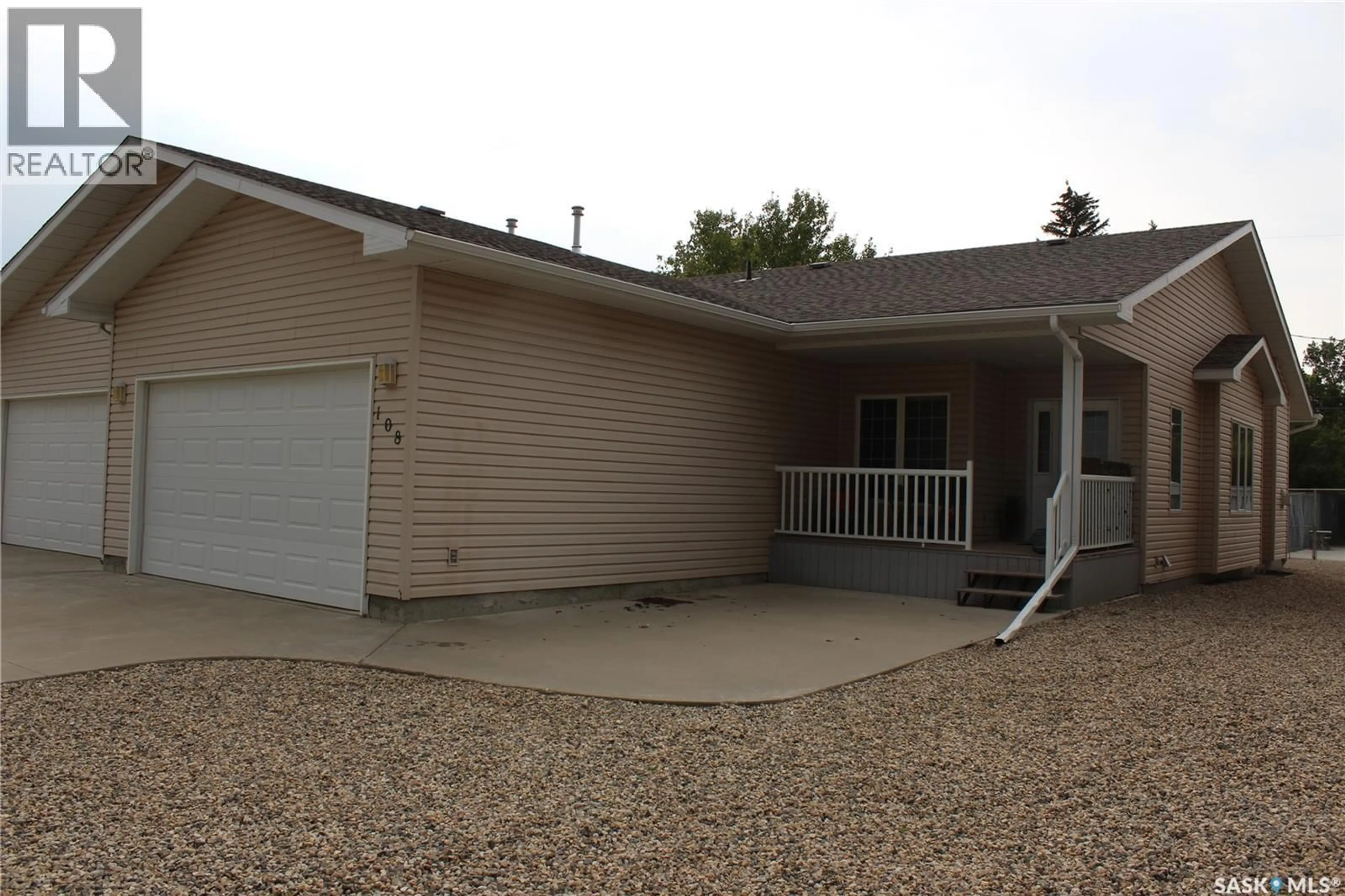 Home with vinyl exterior material, street for 108 ERICKSON STREET, Midale Saskatchewan S0C1S0