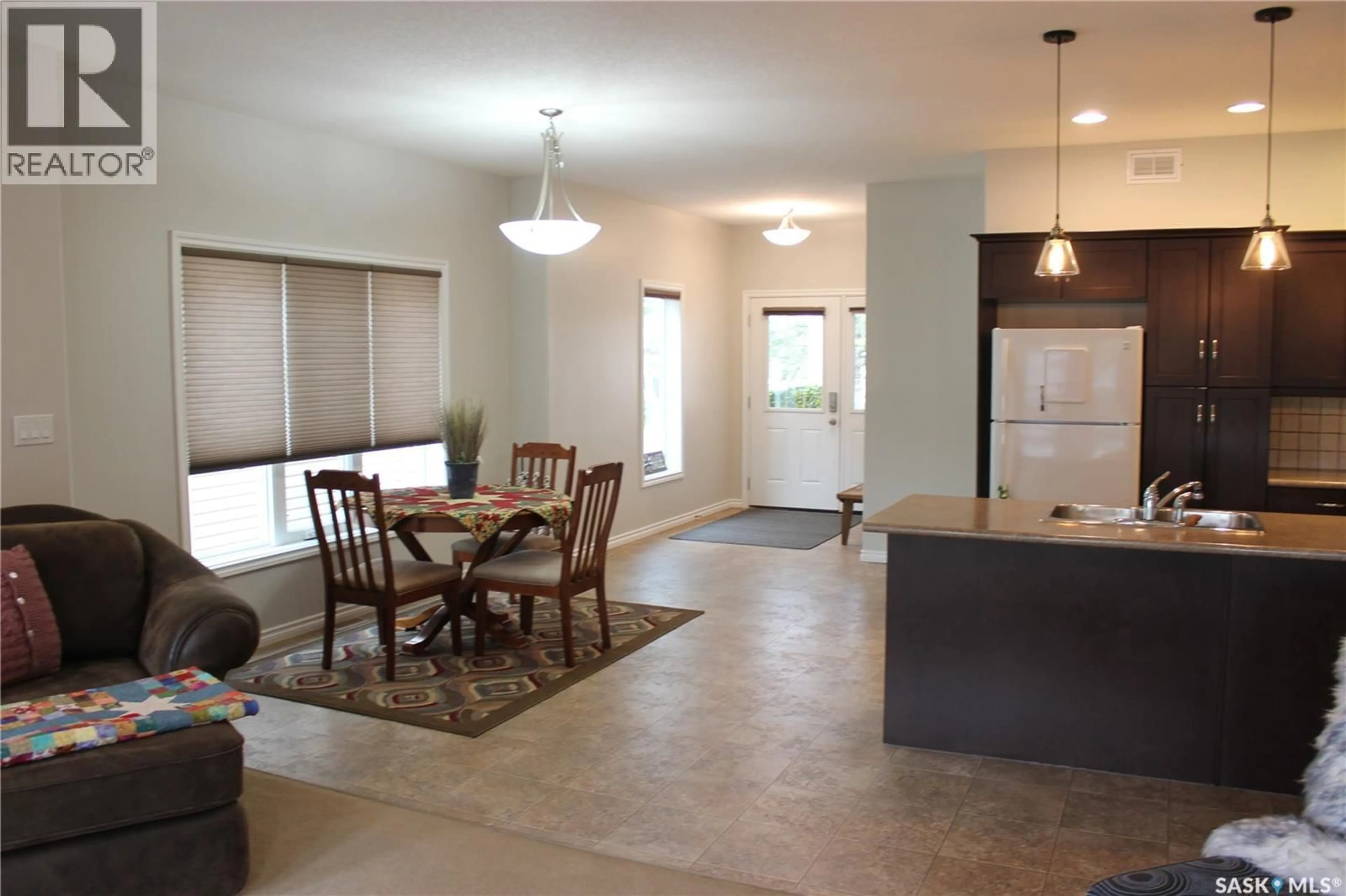Open concept kitchen, ceramic/tile floor for 108 ERICKSON STREET, Midale Saskatchewan S0C1S0