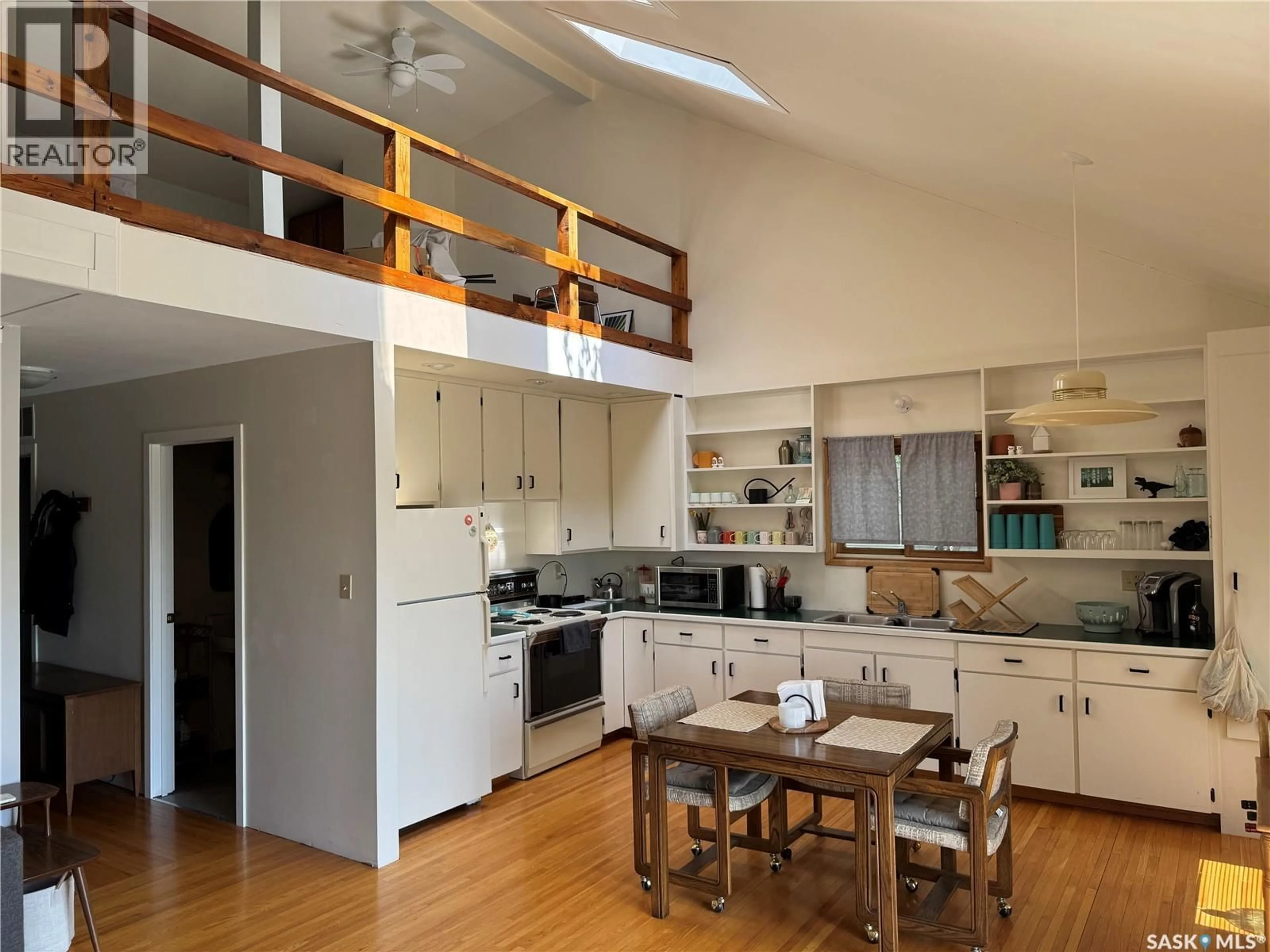 Open concept kitchen, wood/laminate floor for 133 PEBBLE BEACH ROAD, Good Lake Rm No. 274 Saskatchewan S0A0L1