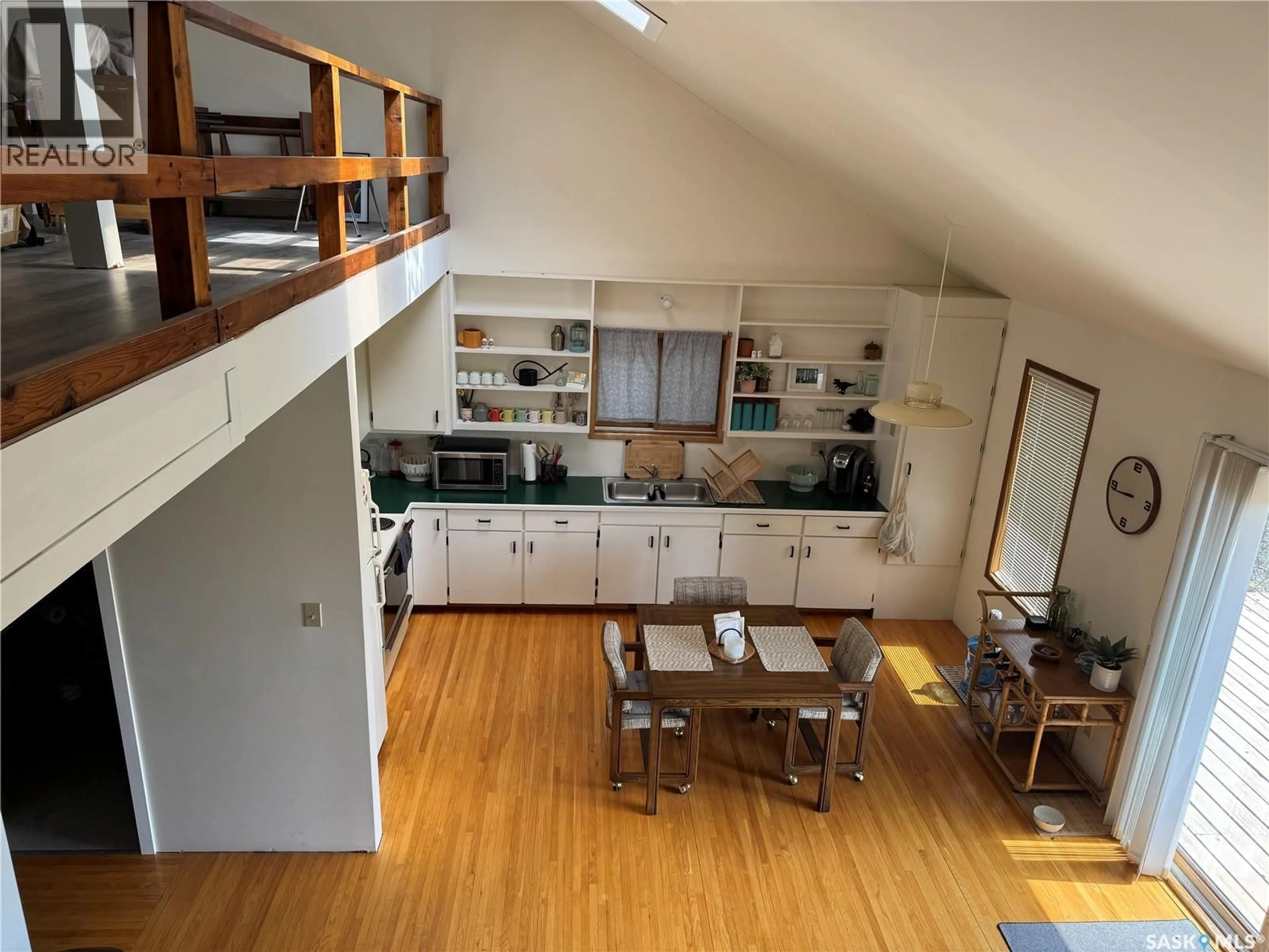 Open concept kitchen, wood/laminate floor for 133 PEBBLE BEACH ROAD, Good Lake Rm No. 274 Saskatchewan S0A0L1