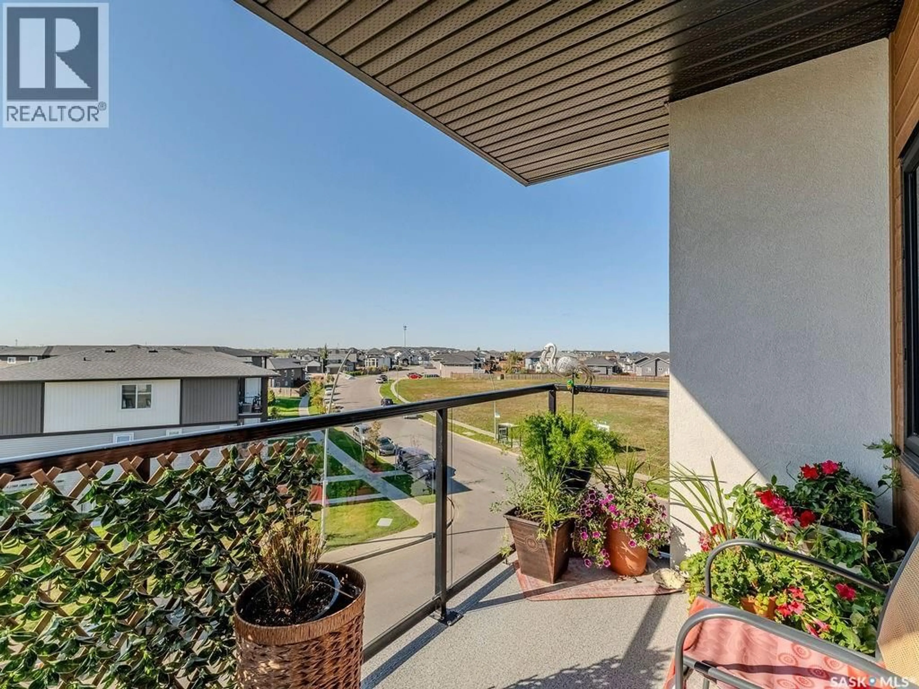 Balcony in the apartment, city buildings view from balcony for 302 720 BALTZAN BOULEVARD, Saskatoon Saskatchewan S7W0W6