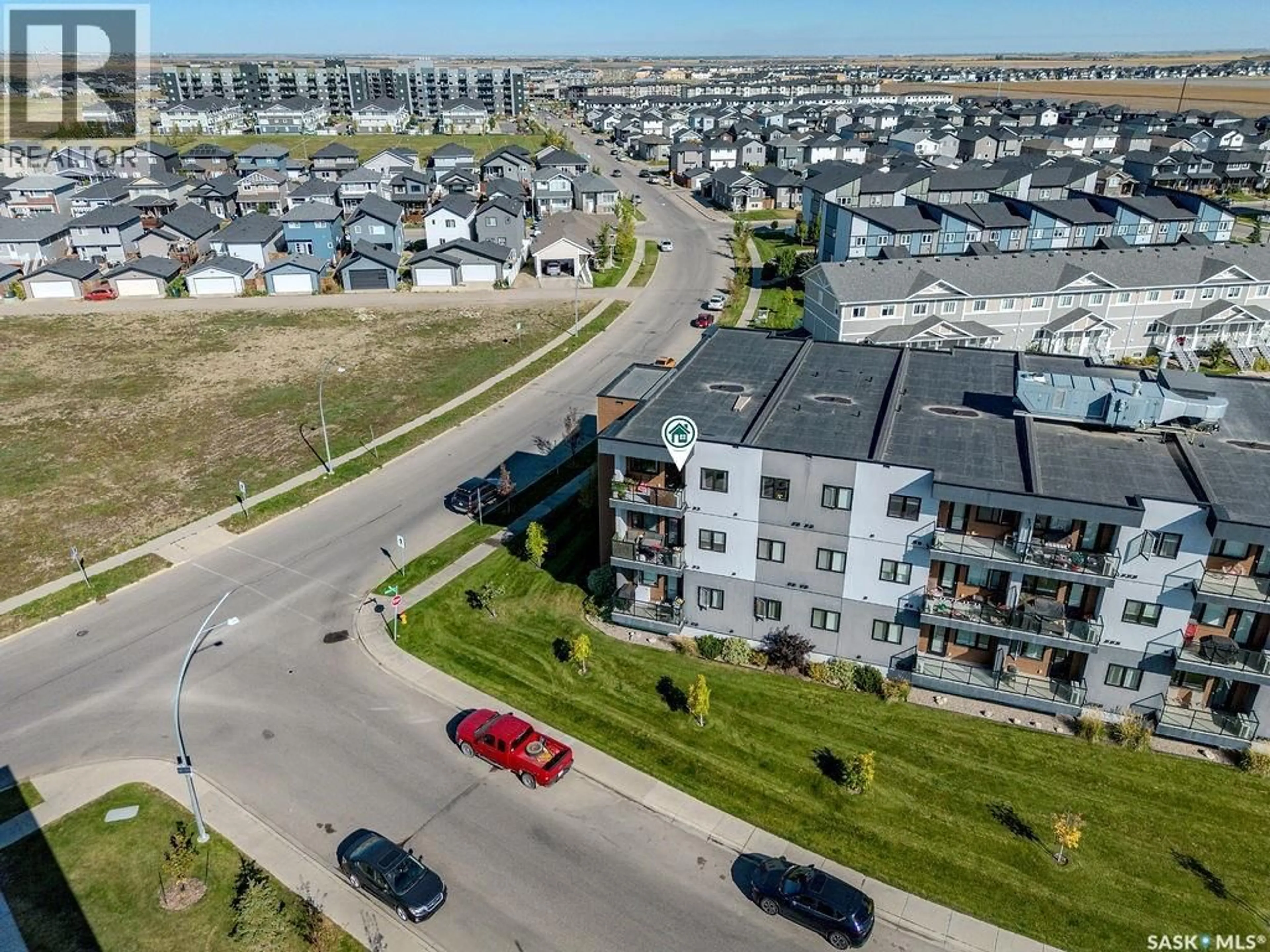 A pic from outside/outdoor area/front of a property/back of a property/a pic from drone, unknown for 302 720 BALTZAN BOULEVARD, Saskatoon Saskatchewan S7W0W6