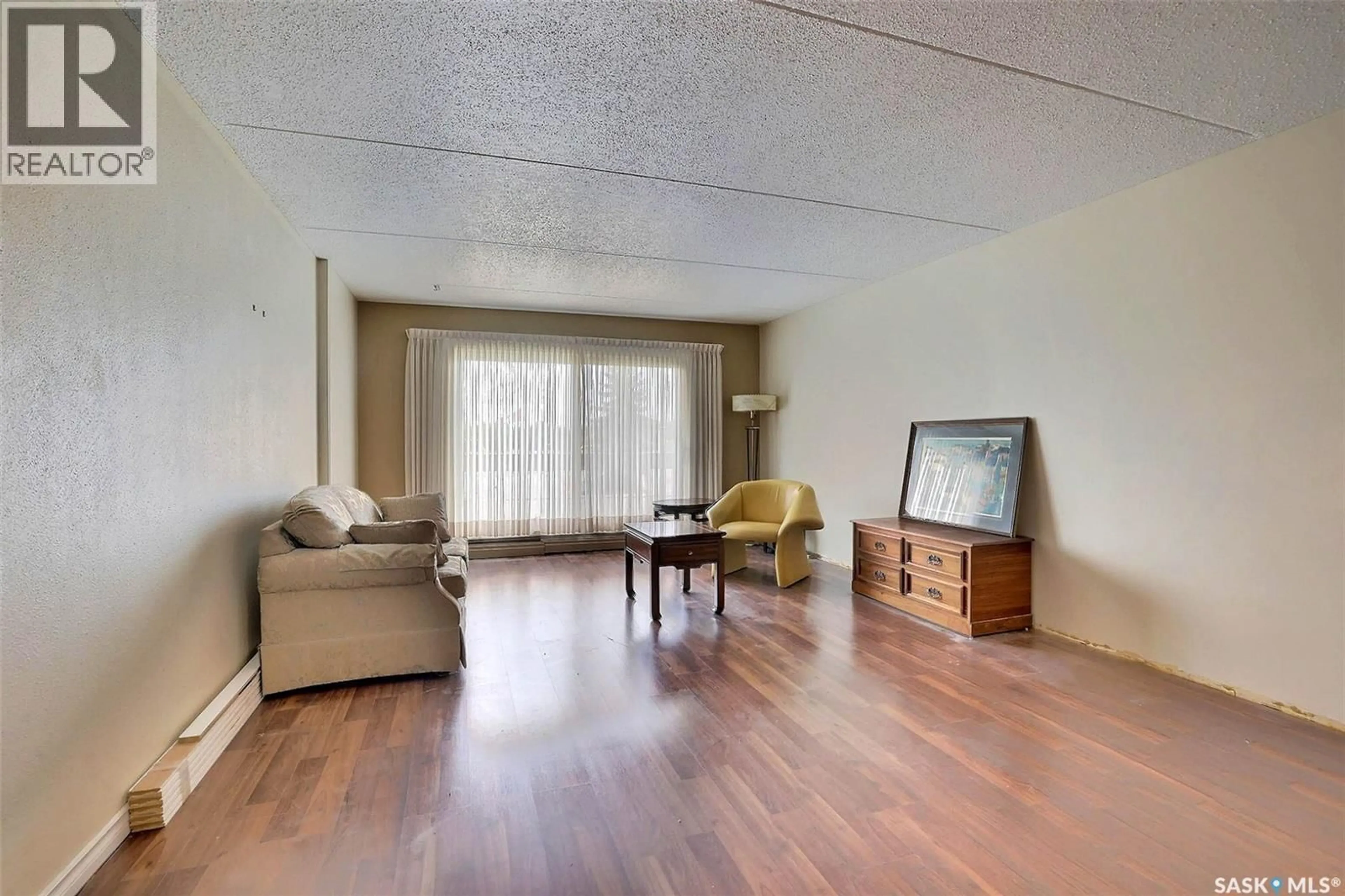 Living room with furniture, wood/laminate floor for 204 - 3520 HILLSDALE STREET, Regina Saskatchewan S4S5Z5