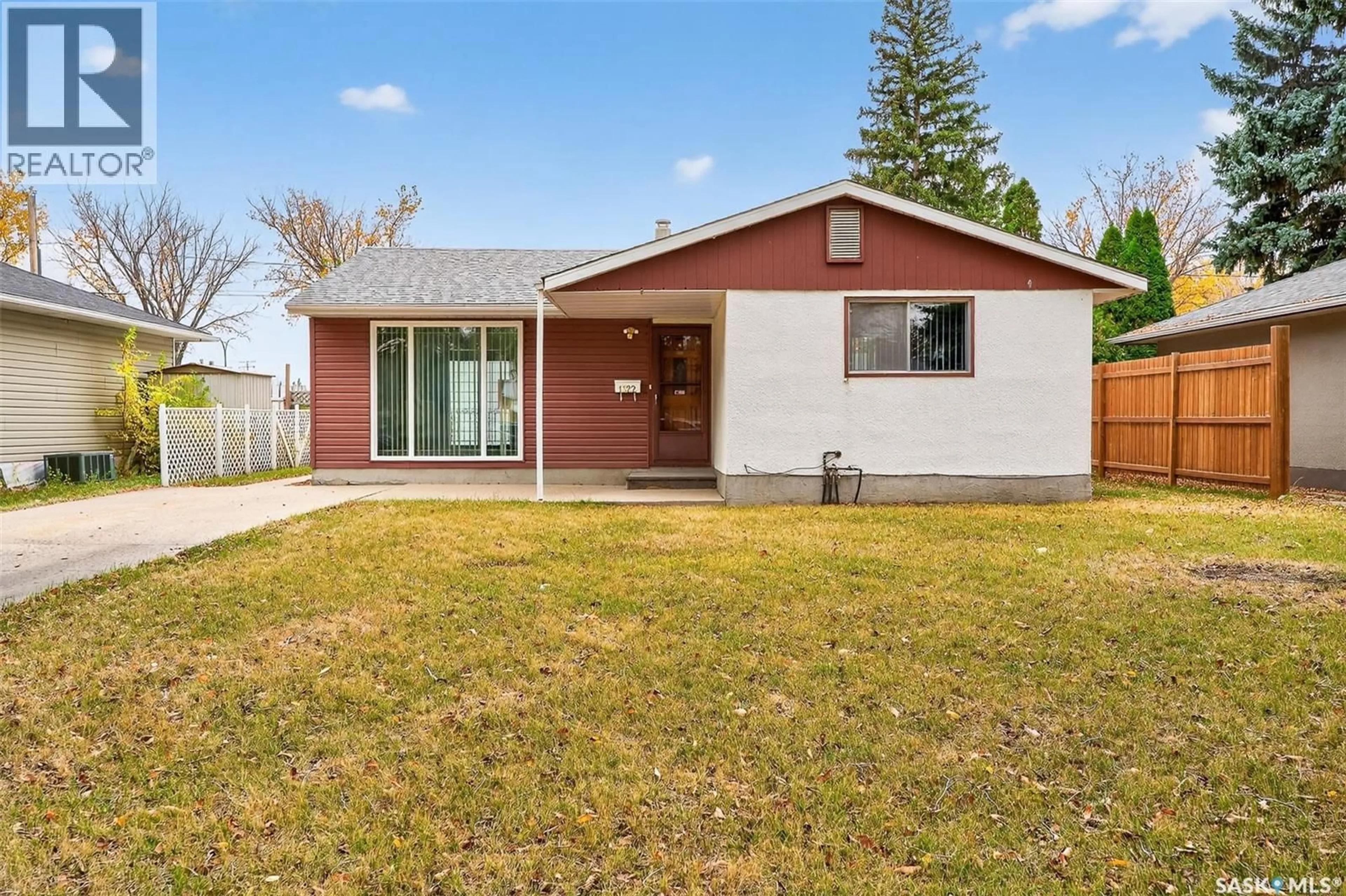 Home with vinyl exterior material, street for 1322 7TH AVENUE, Moose Jaw Saskatchewan S6H4C9