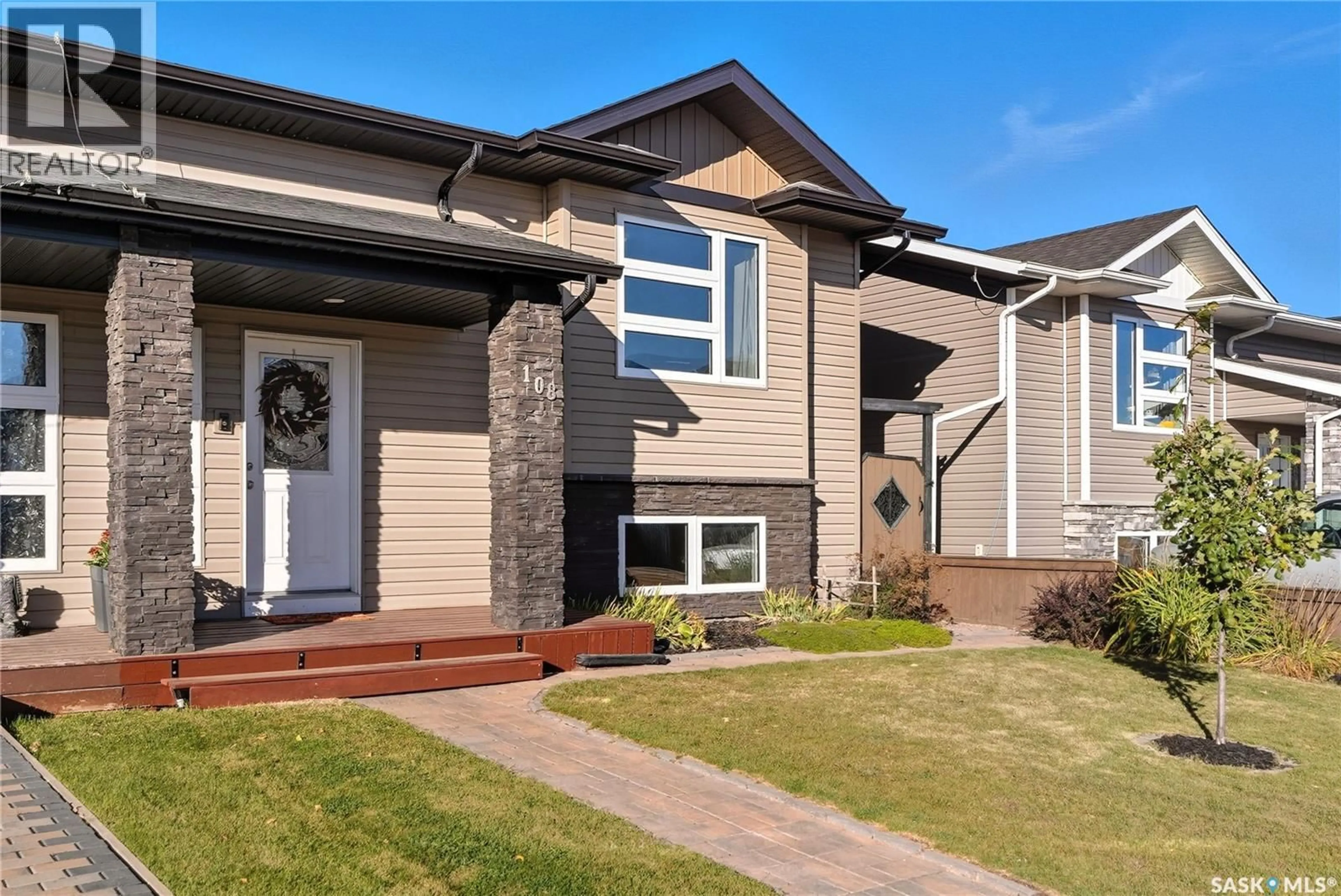 Home with vinyl exterior material, street for 108 REDDEKOPP CRESCENT, Warman Saskatchewan S0K4S3