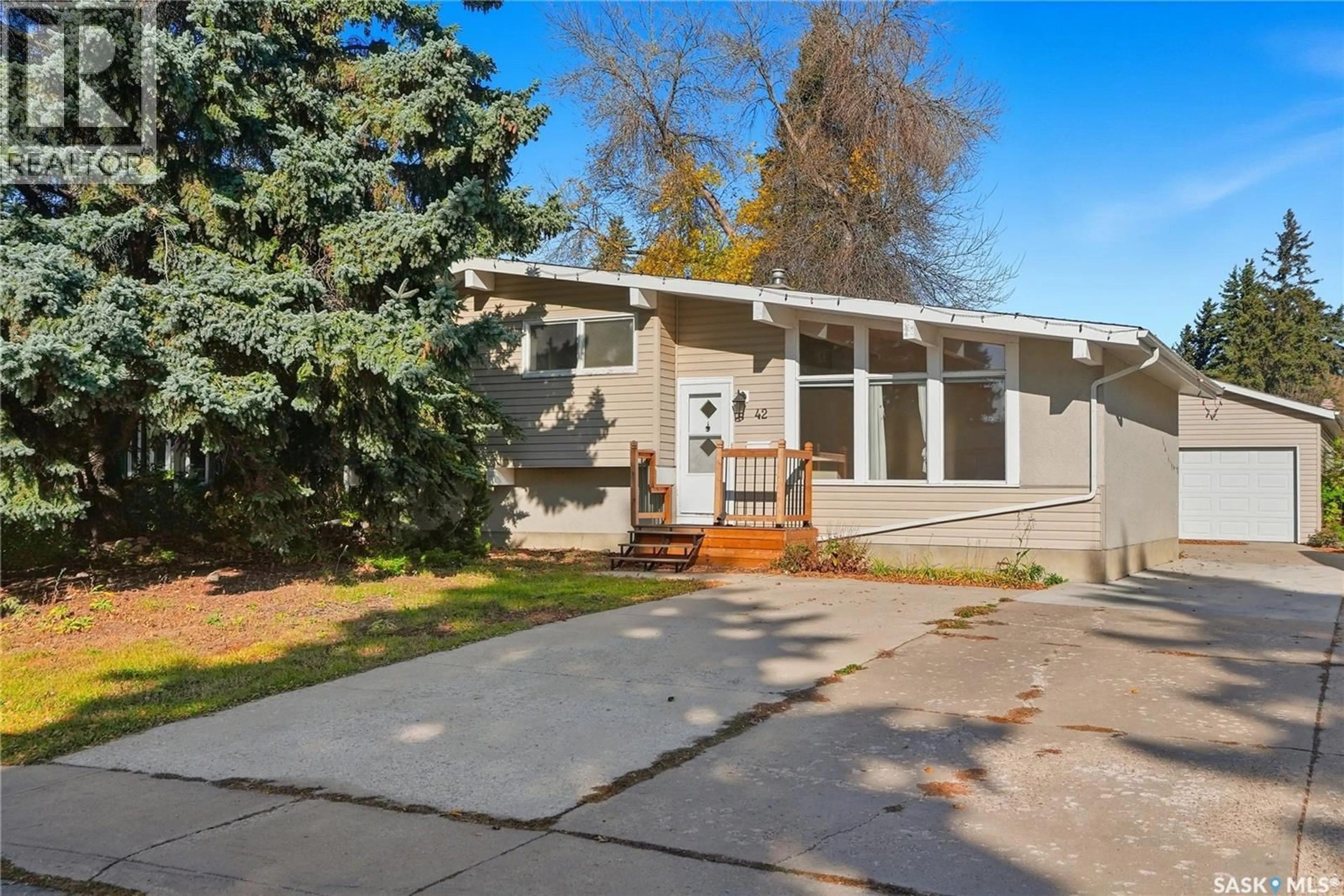 Home with vinyl exterior material, street for 42 RED RIVER ROAD, Saskatoon Saskatchewan S7K1G3