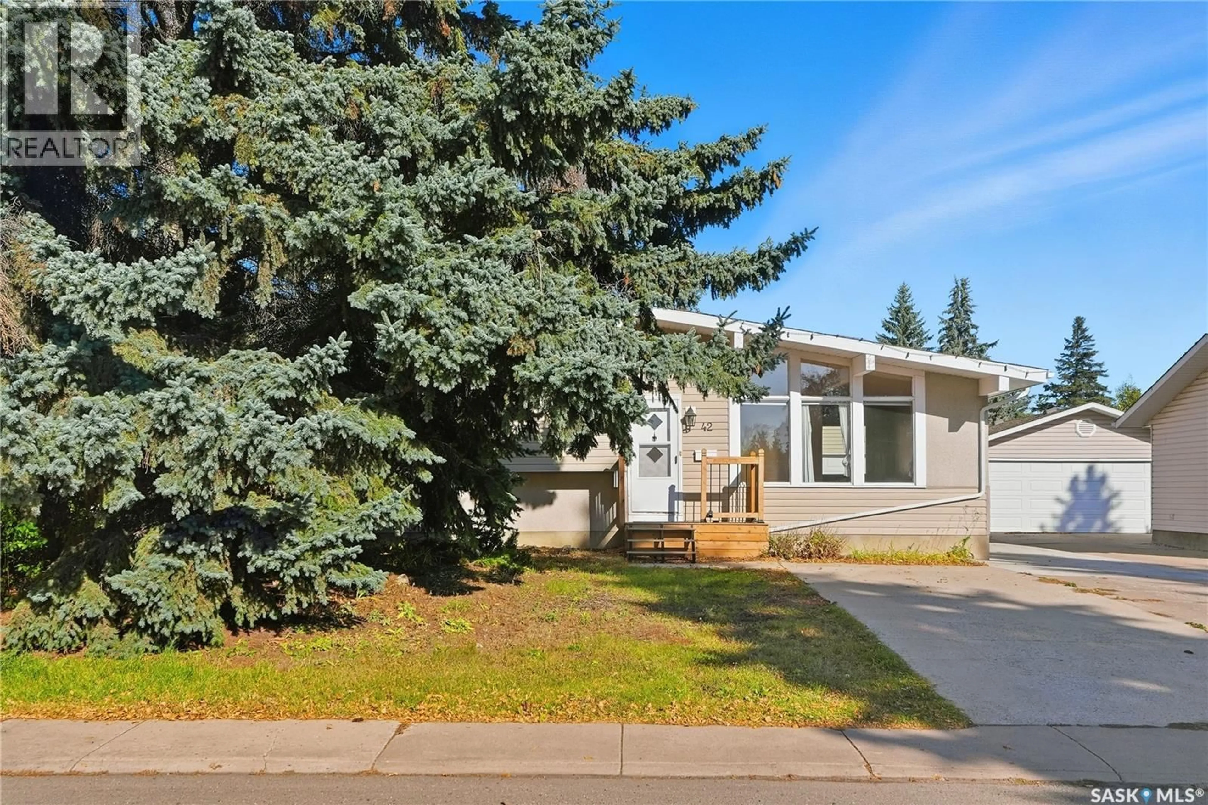 Home with vinyl exterior material, street for 42 RED RIVER ROAD, Saskatoon Saskatchewan S7K1G3