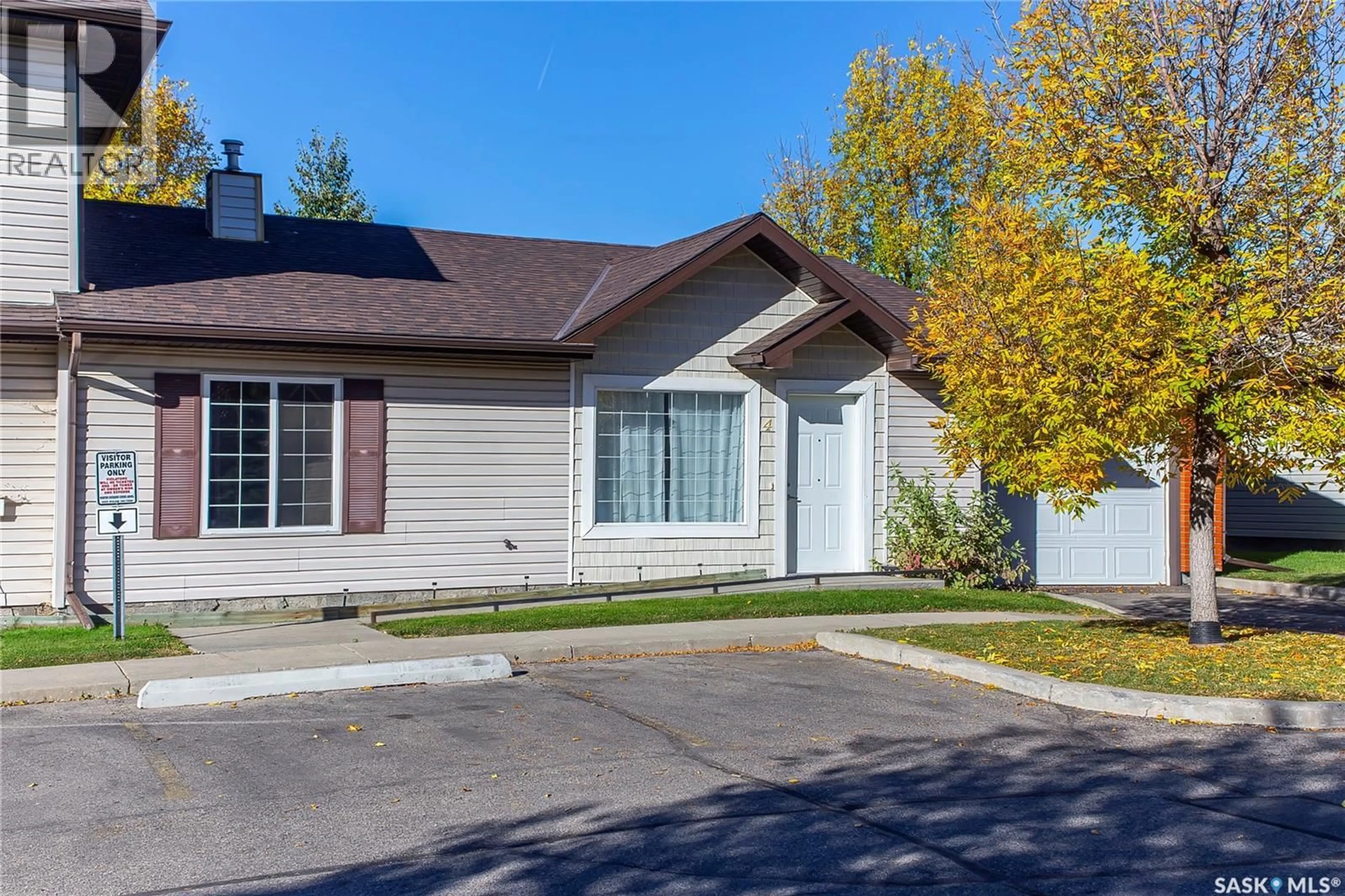 Home with vinyl exterior material, street for 4 135 KEEDWELL STREET, Saskatoon Saskatchewan S7W0A3