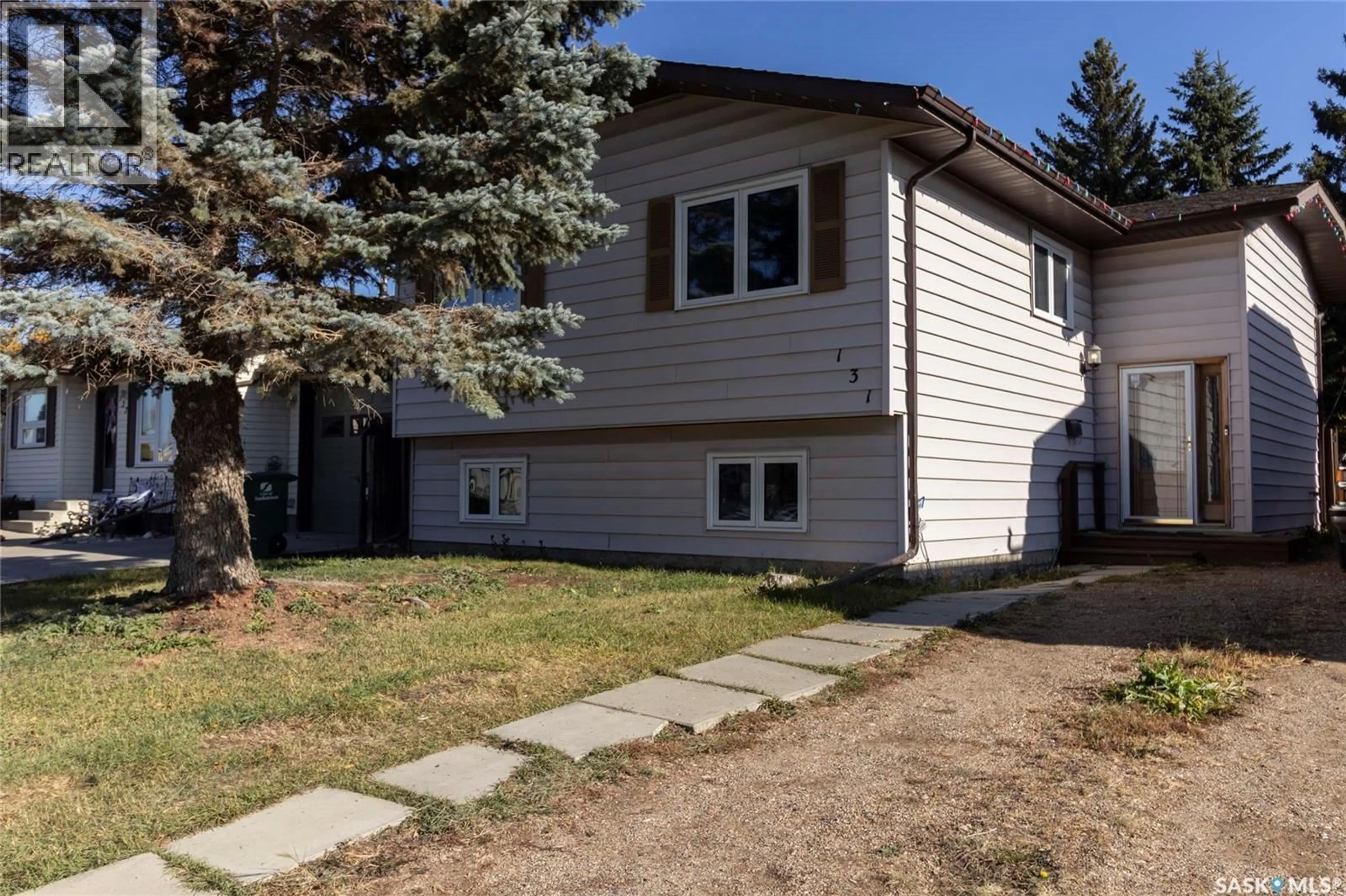 Home with vinyl exterior material, street for 131 SHERRY CRESCENT, Saskatoon Saskatchewan S7M5R2