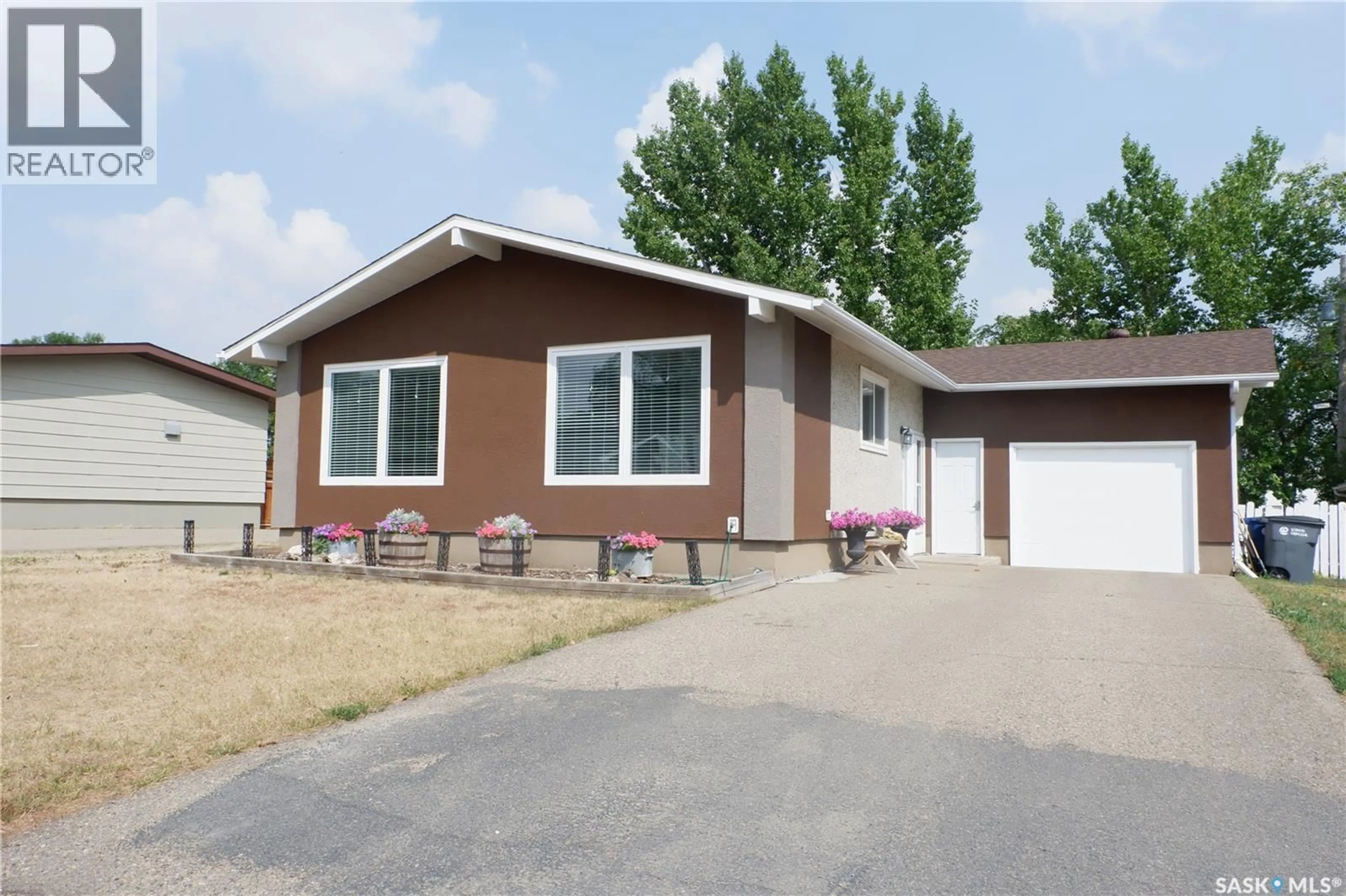 Home with vinyl exterior material, street for 107 EMPIRE PLACE, Assiniboia Saskatchewan S0H0B0
