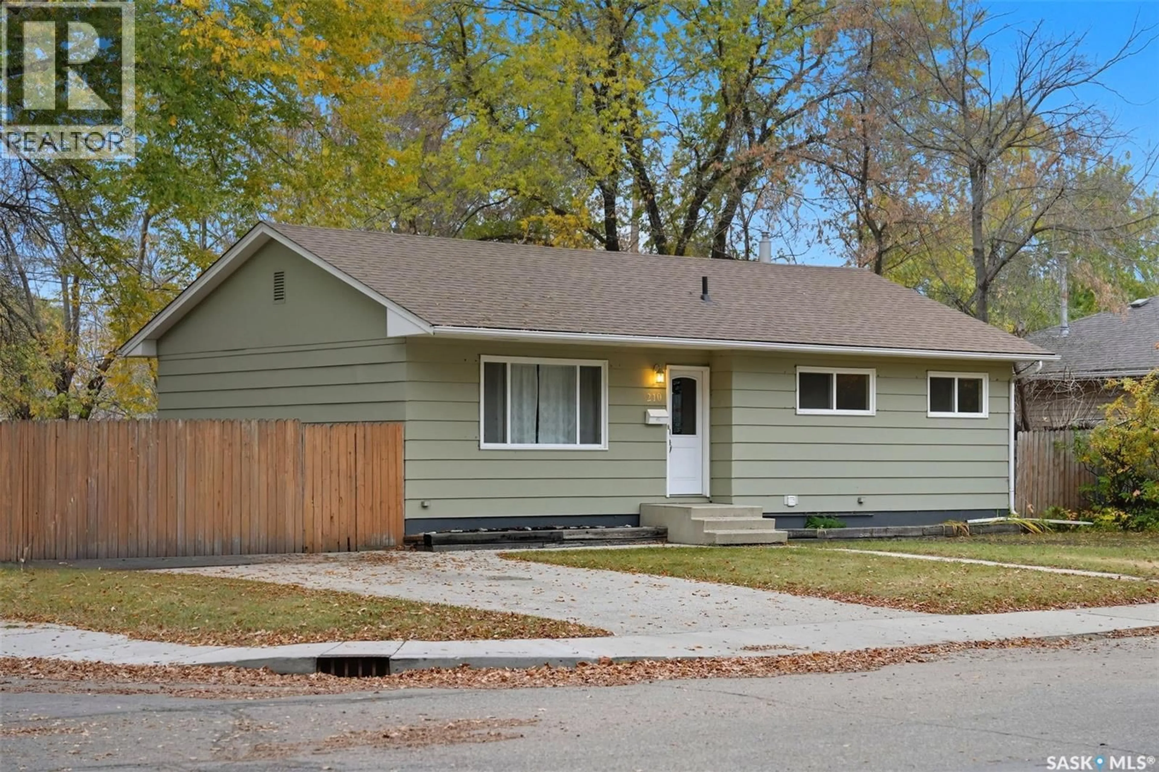 Home with vinyl exterior material, street for 210 CASCADE STREET, Saskatoon Saskatchewan S7J0M3