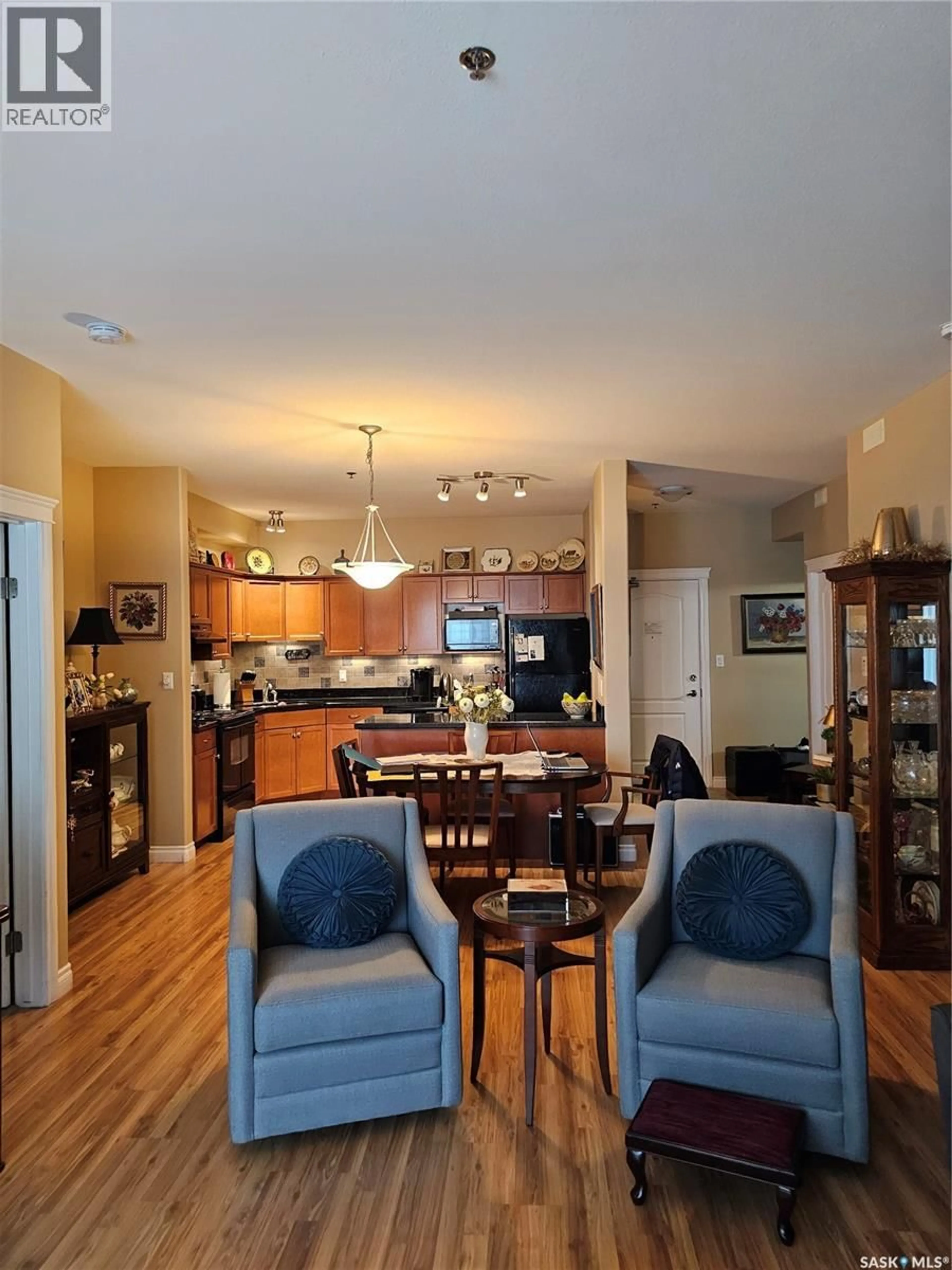 Open concept kitchen, wood/laminate floor for 310 333 NELSON ROAD, Saskatoon Saskatchewan S7S1P2