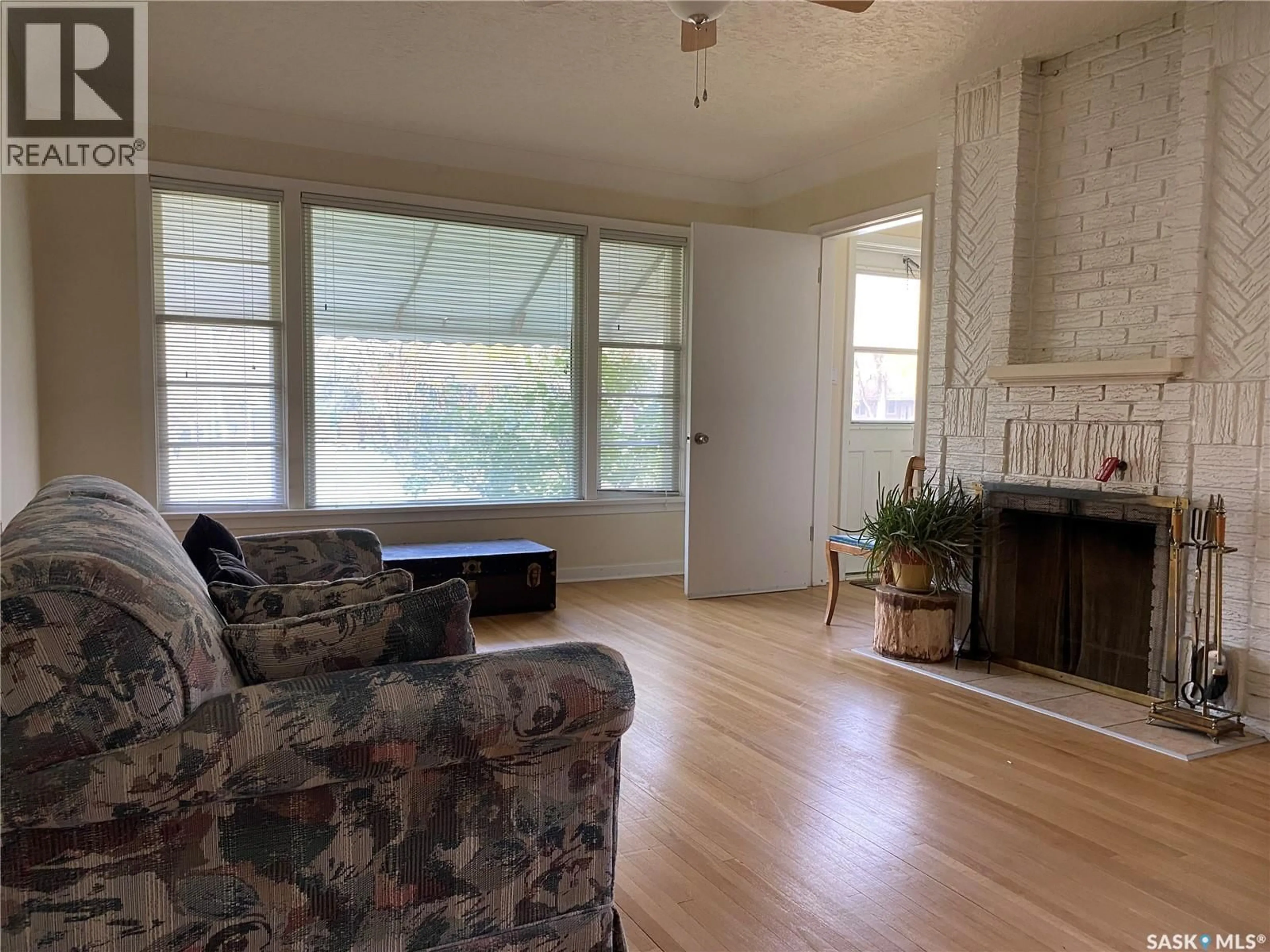 Living room with furniture, wood/laminate floor for 2645 WINNIPEG STREET, Regina Saskatchewan S4P1H8