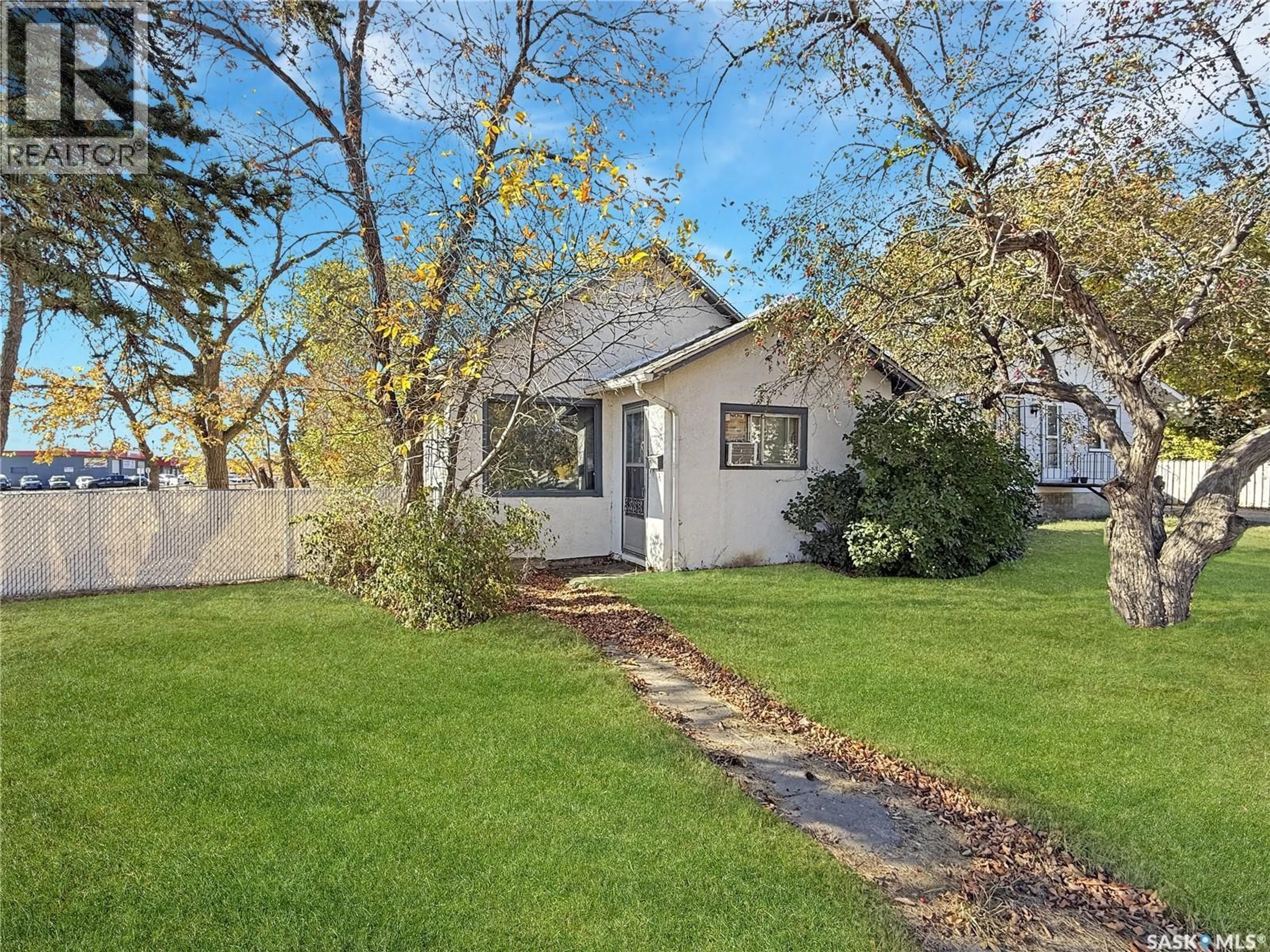 A pic from outside/outdoor area/front of a property/back of a property/a pic from drone, street for 206 6TH AVENUE, Swift Current Saskatchewan S9H0X8