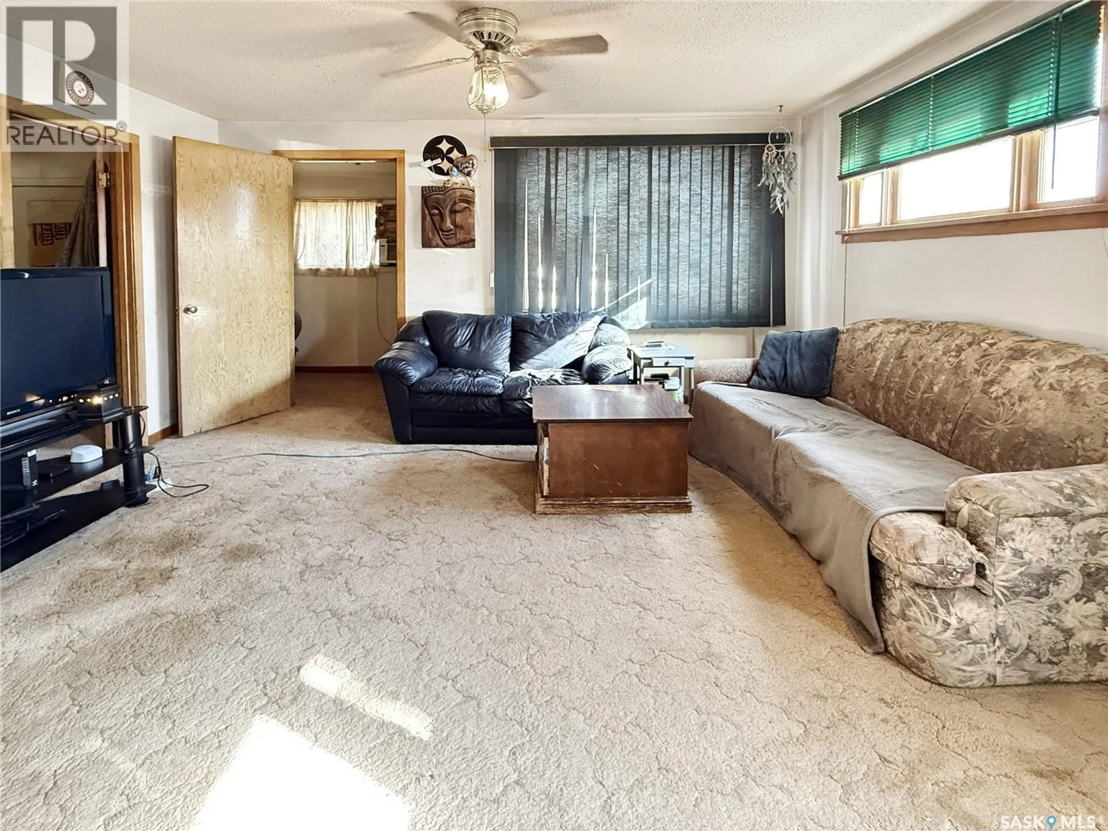 Living room with furniture, carpet floor for 206 6TH AVENUE, Swift Current Saskatchewan S9H0X8