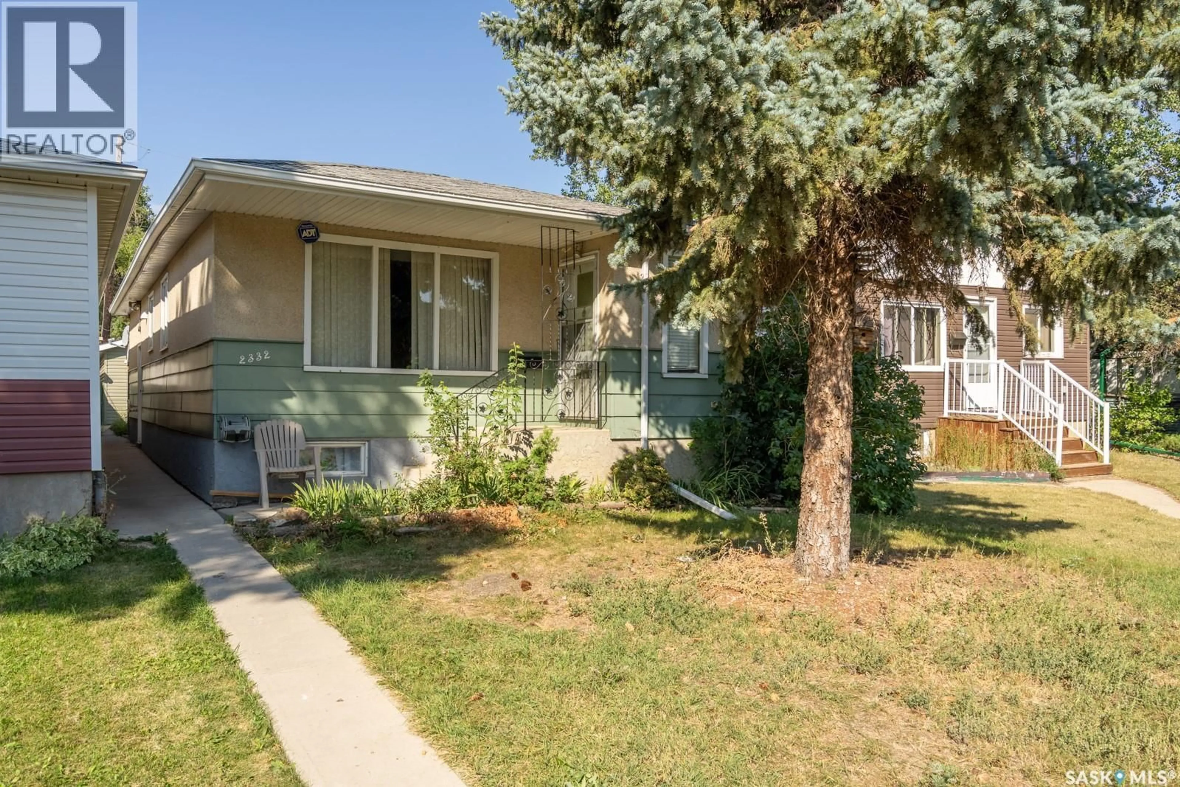 Home with vinyl exterior material, street for 2332 MCDONALD STREET, Regina Saskatchewan S4N2Z1