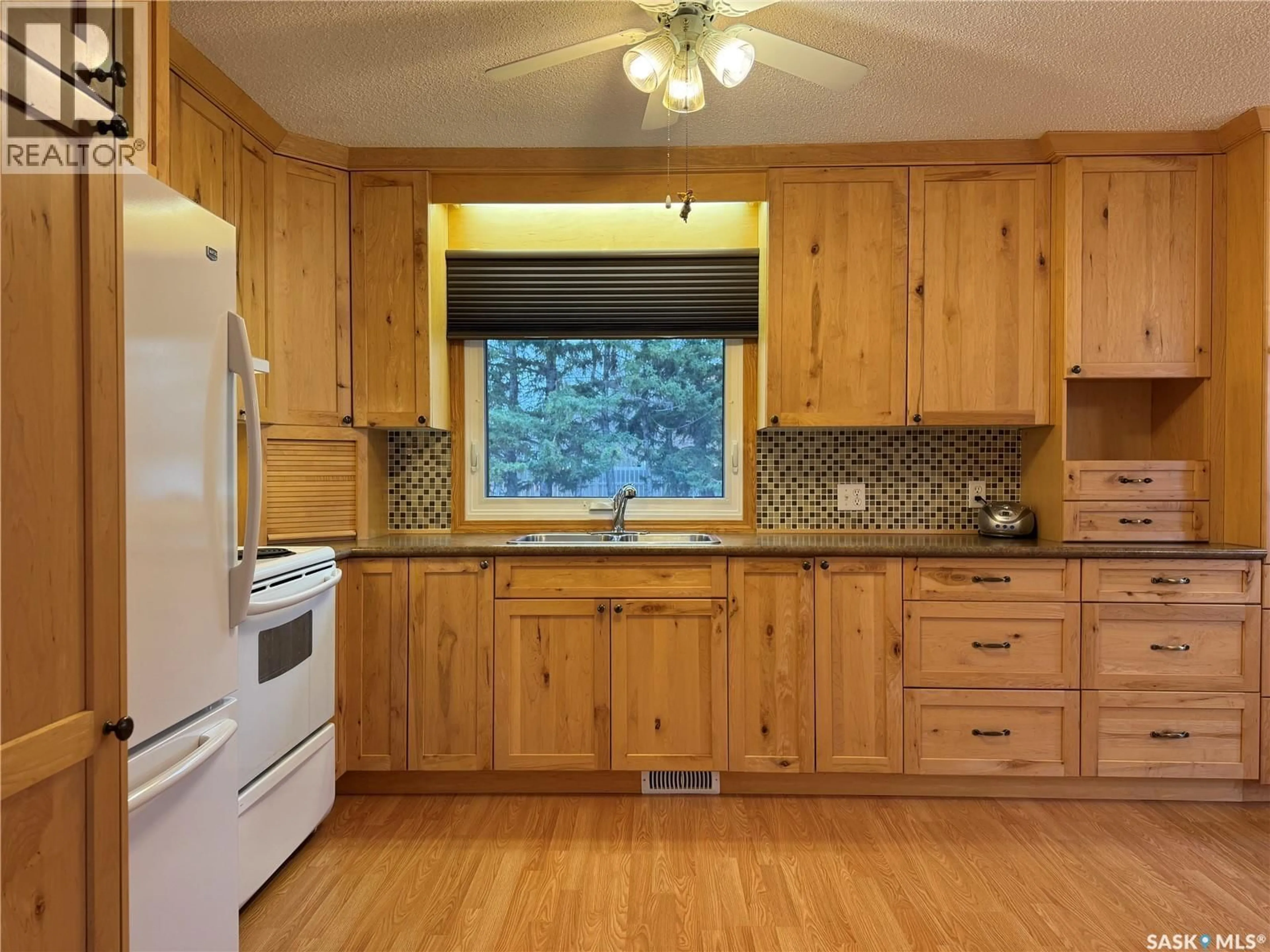 Standard kitchen, wood/laminate floor for 127 BROADWAY STREET, Foam Lake Saskatchewan S0A1A0