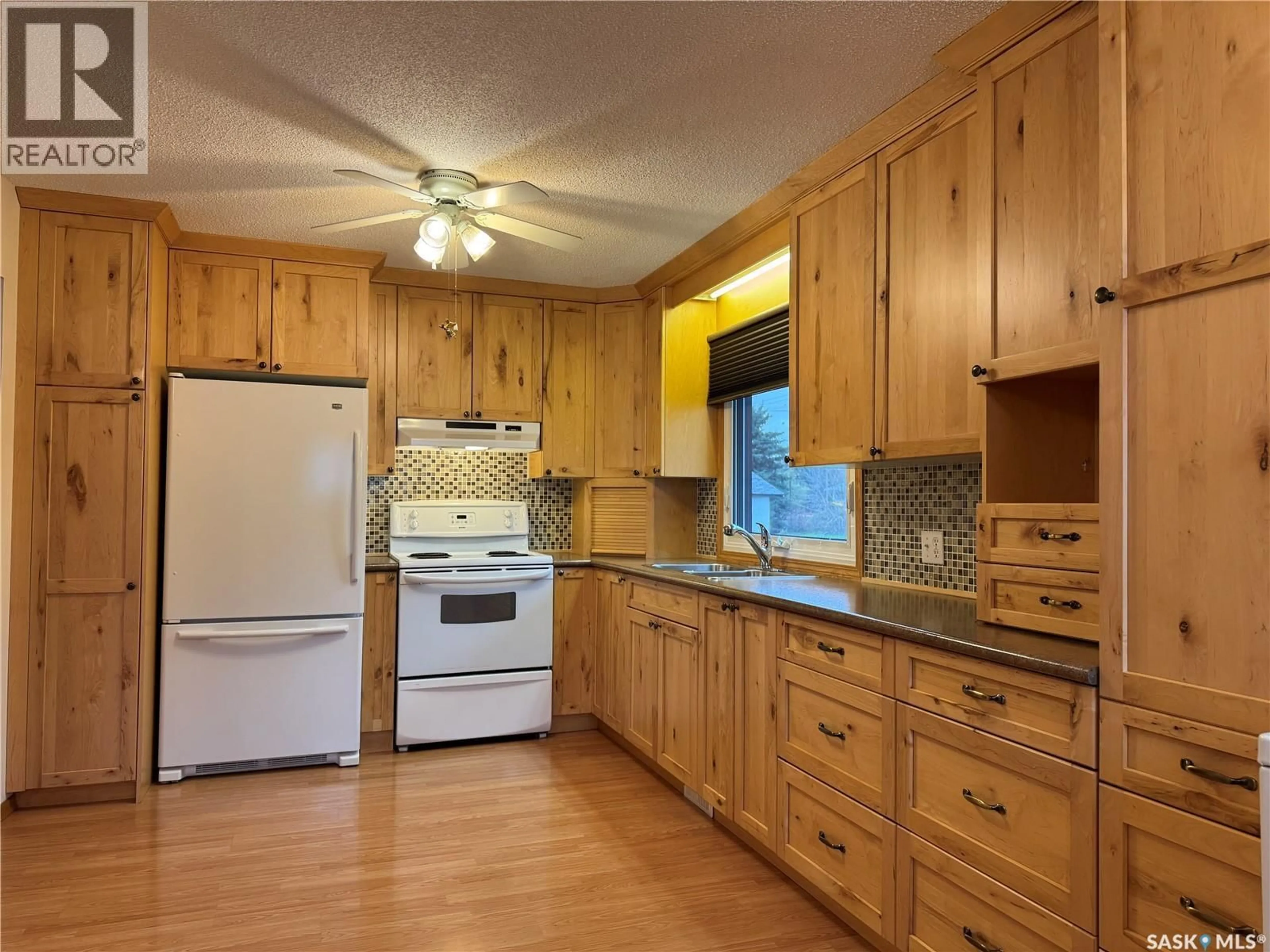 Standard kitchen, wood/laminate floor for 127 BROADWAY STREET, Foam Lake Saskatchewan S0A1A0