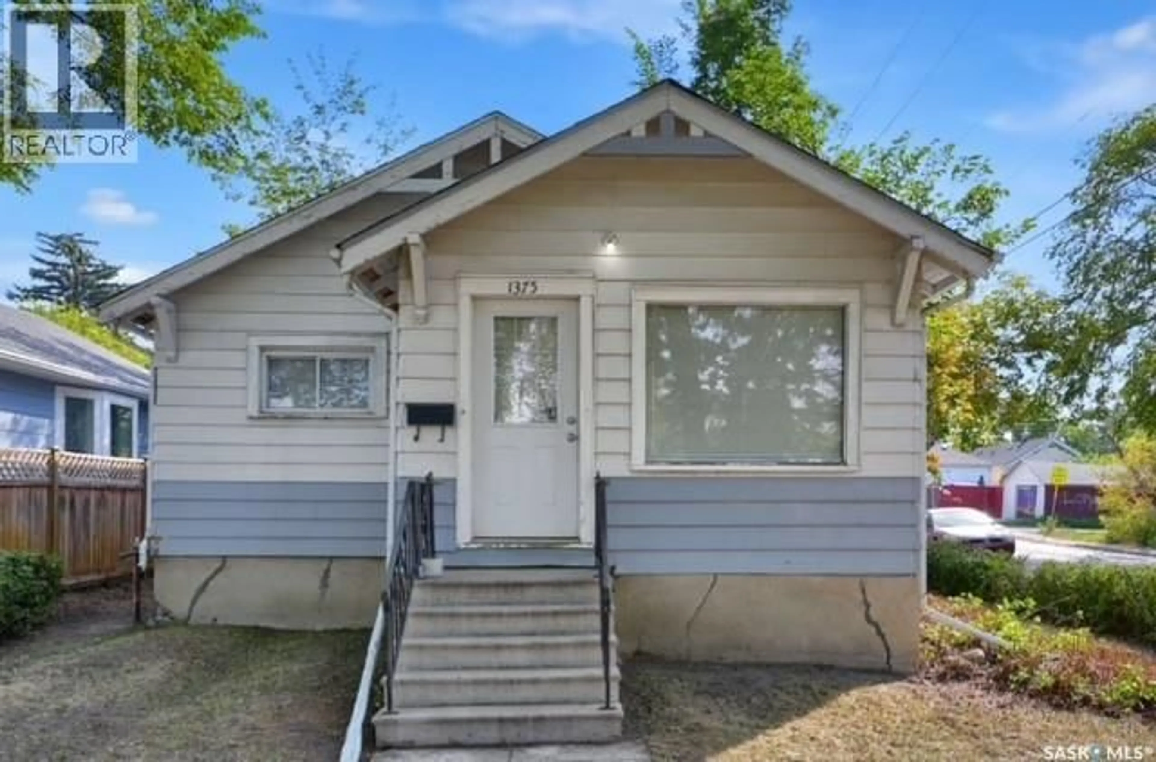 Home with vinyl exterior material, street for 1375 ELPHINSTONE STREET, Regina Saskatchewan S4T3M5