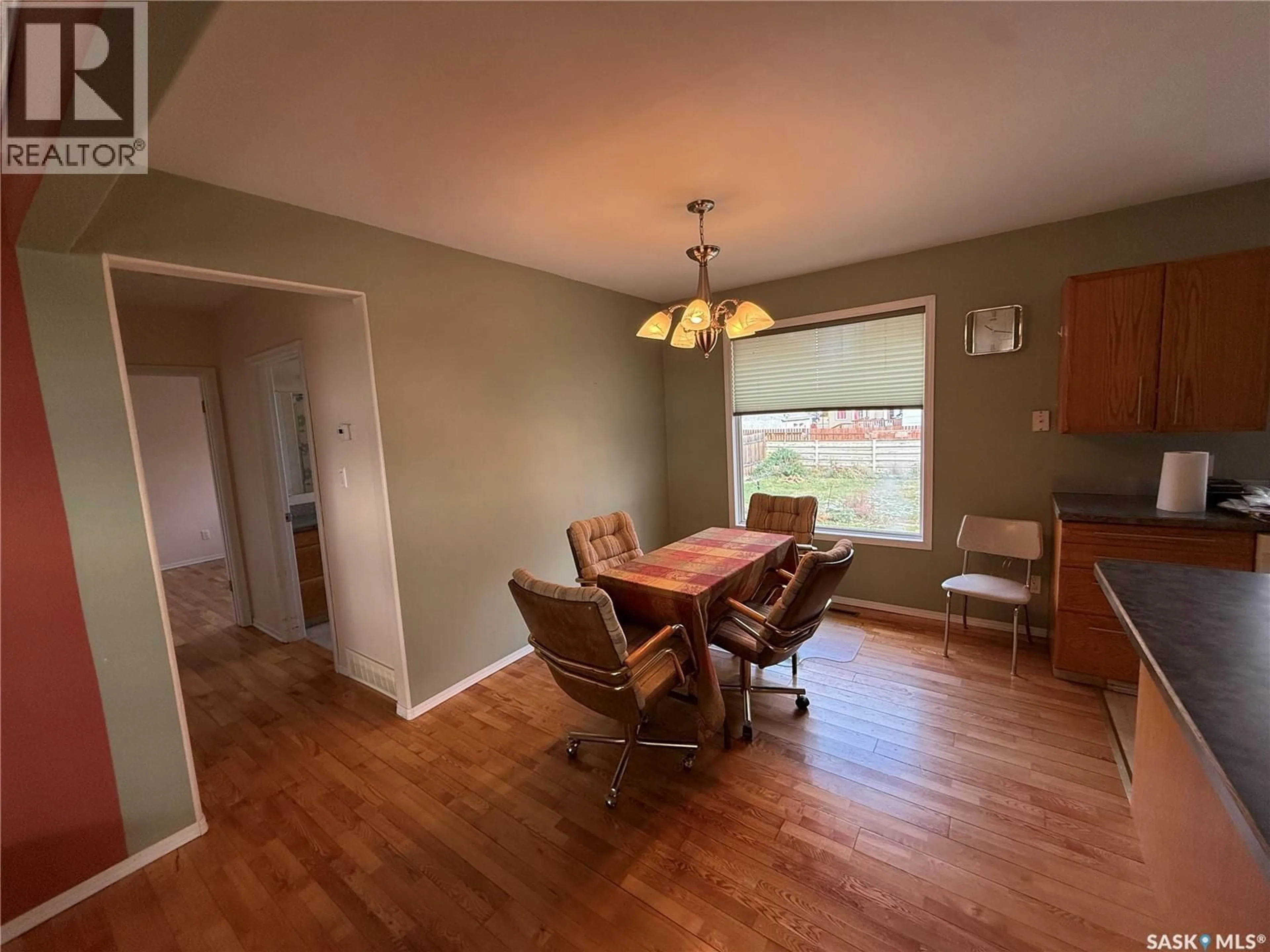 Dining room, wood/laminate floor for 507 7TH AVENUE, Assiniboia Saskatchewan S0H0B0