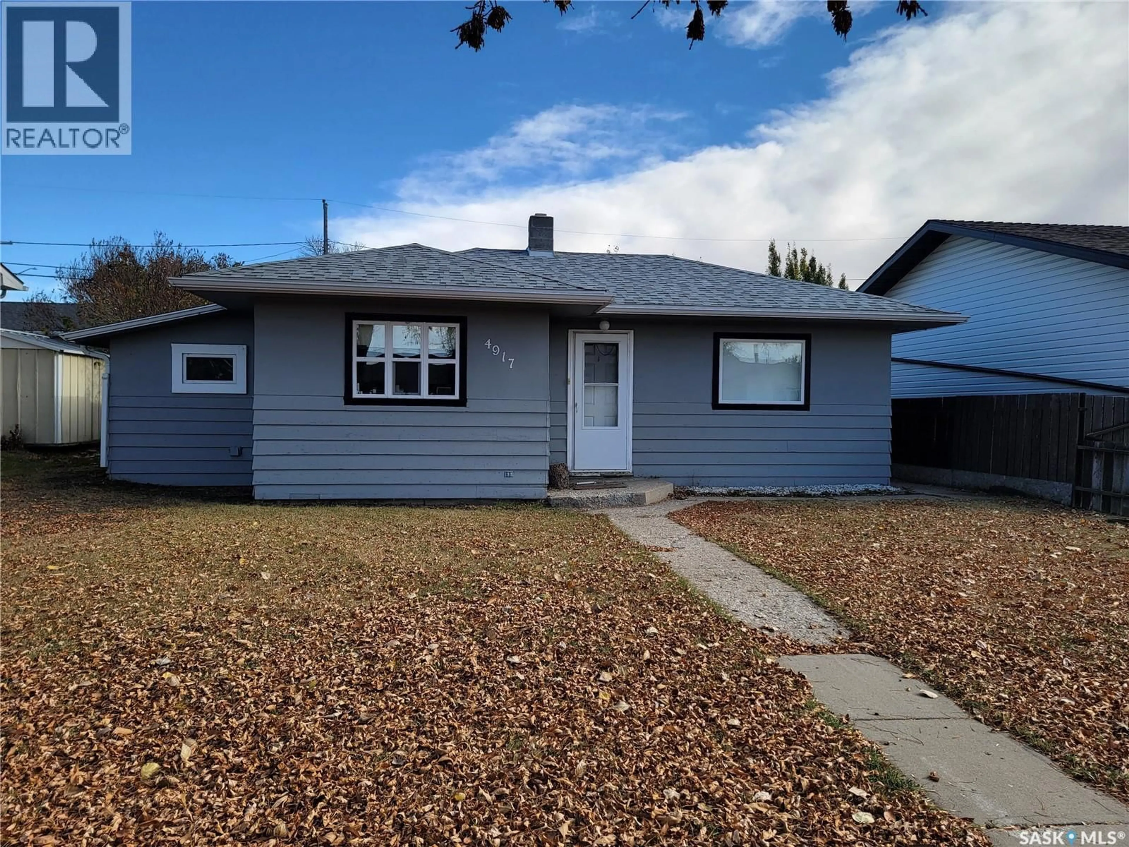 Home with vinyl exterior material, street for 4917 TELEGRAPH STREET, Macklin Saskatchewan S0L2C0