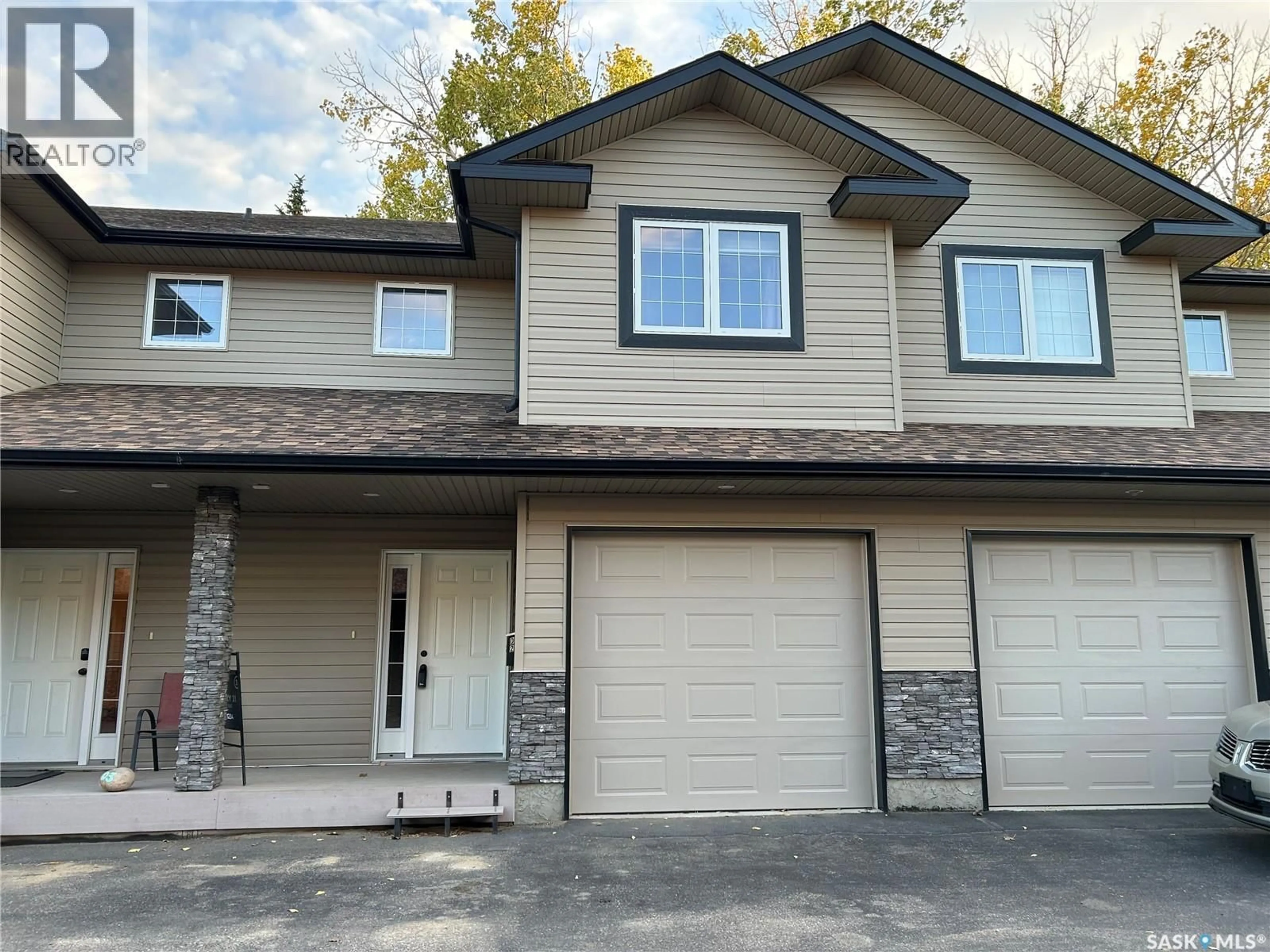 Home with vinyl exterior material, street for D2 - 33 WOOD LILY DRIVE, Moose Jaw Saskatchewan S6J1E4