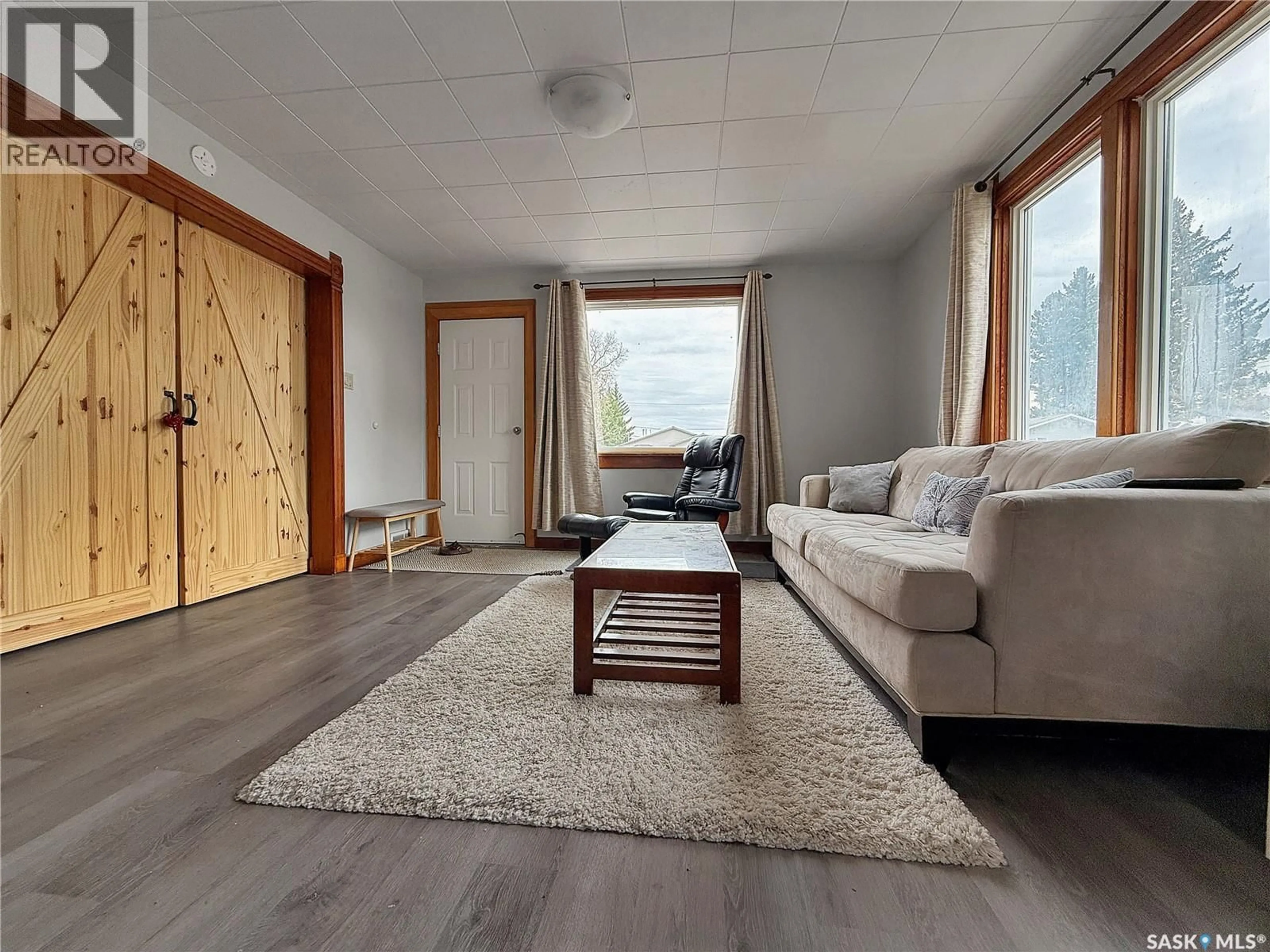 Living room with furniture, wood/laminate floor for 106 CARLTON STREET, Rocanville Saskatchewan S0A3L0