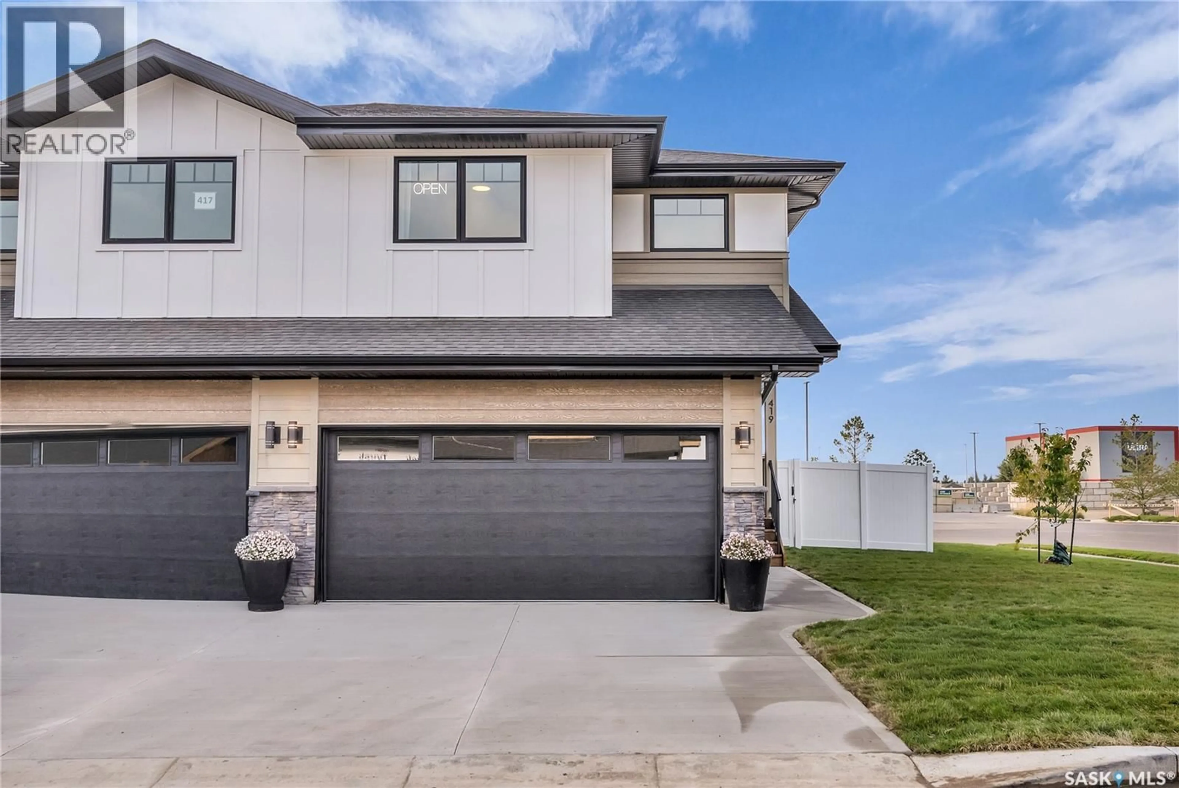 Home with vinyl exterior material, street for 403 155 MCFAULL WAY, Saskatoon Saskatchewan S7V0Y2