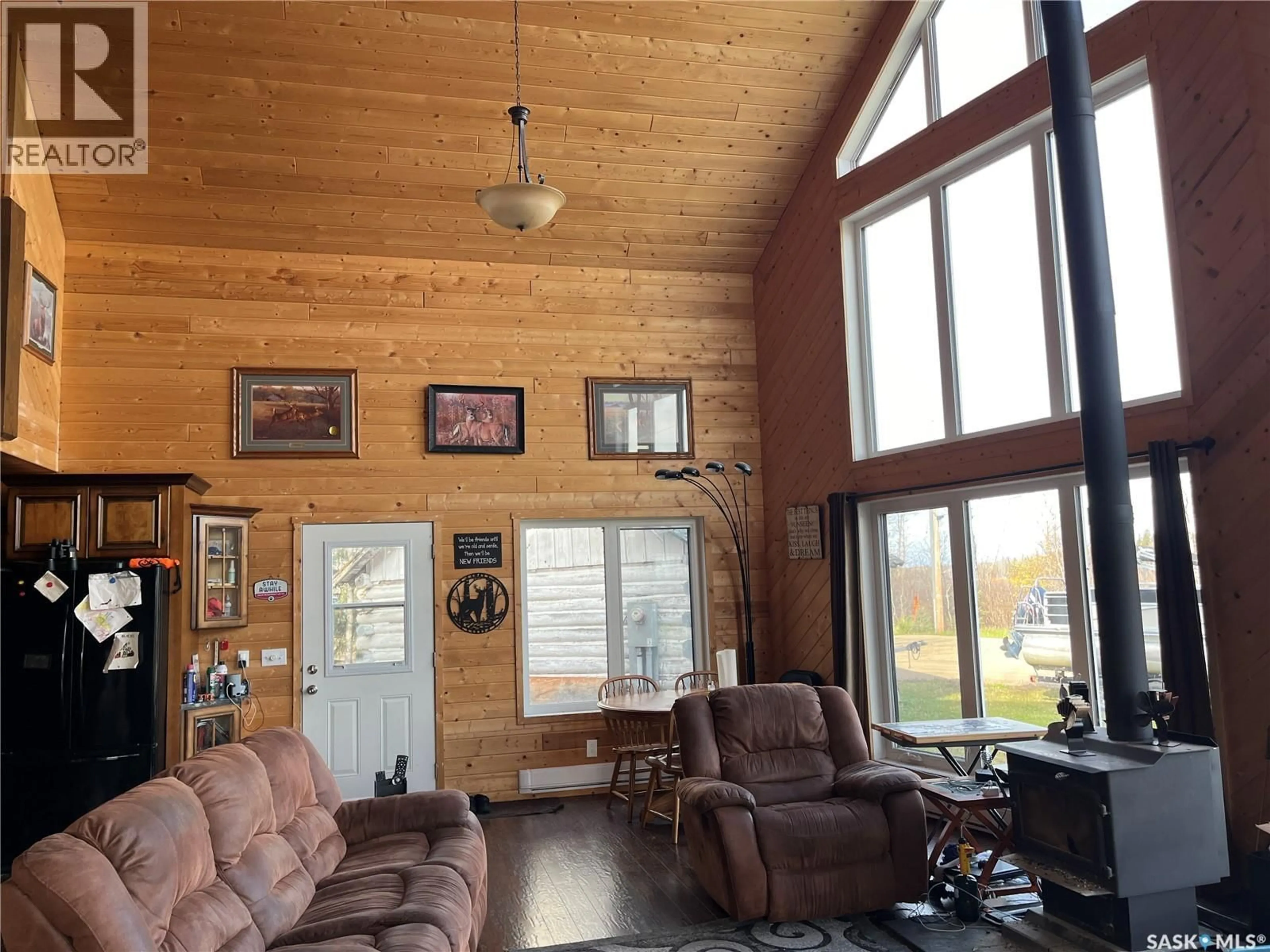 Living room with furniture, wood/laminate floor for 6 DELARONDE AVENUE, Big River Rm No. 555 Saskatchewan S0J0E0