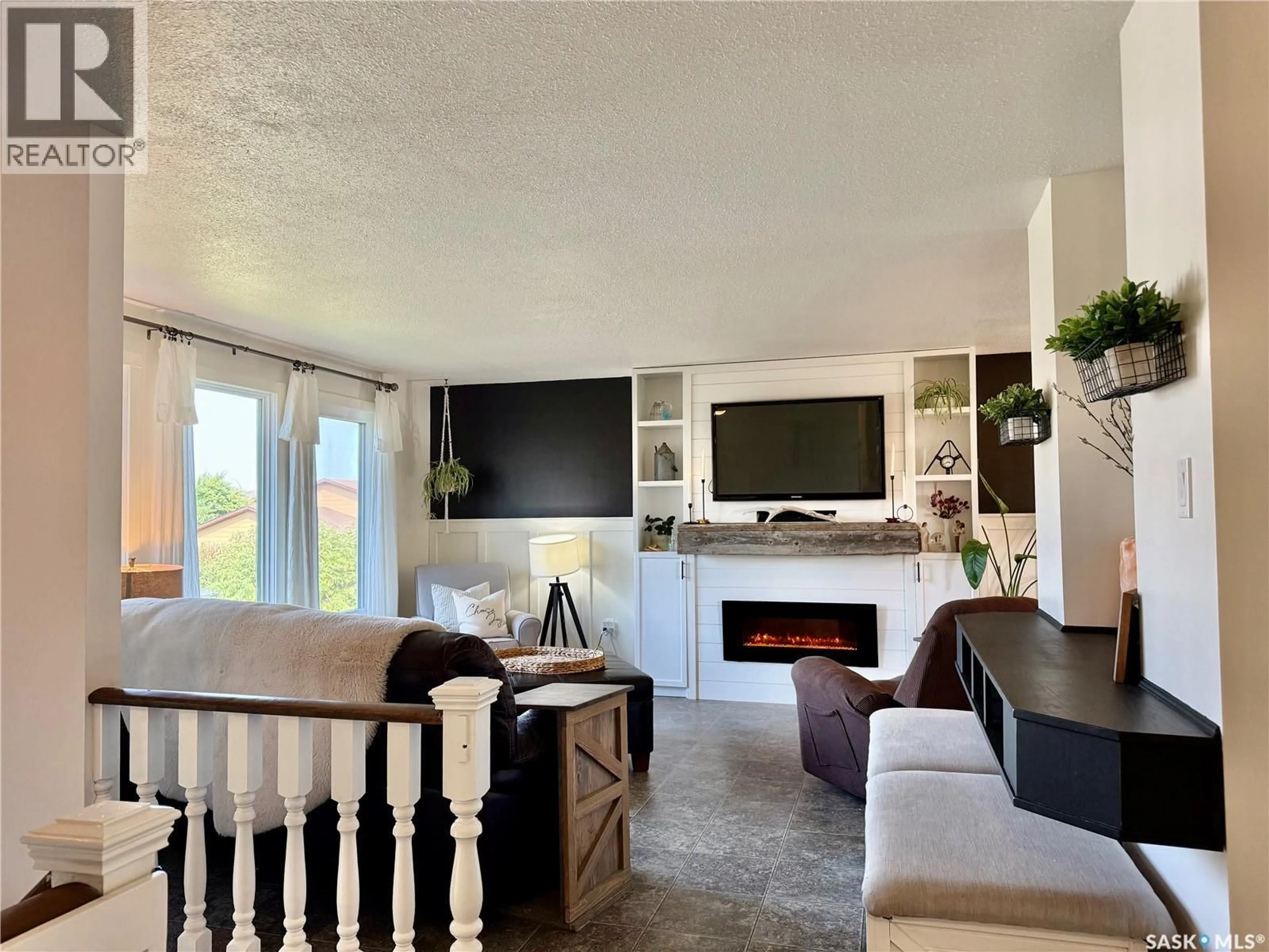 Living room with furniture, unknown for 38 HOWARD CRESCENT, Lanigan Saskatchewan S0K2M0