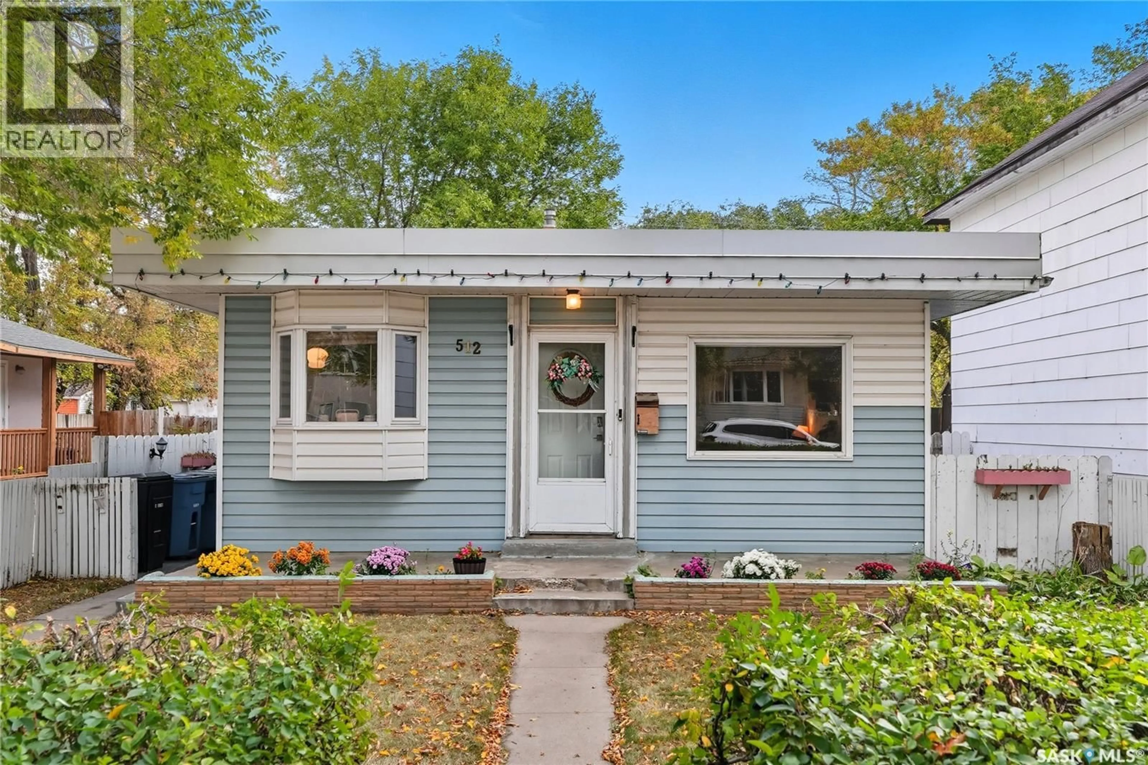 Home with vinyl exterior material, street for 512 I AVENUE, Saskatoon Saskatchewan S7M1Y5