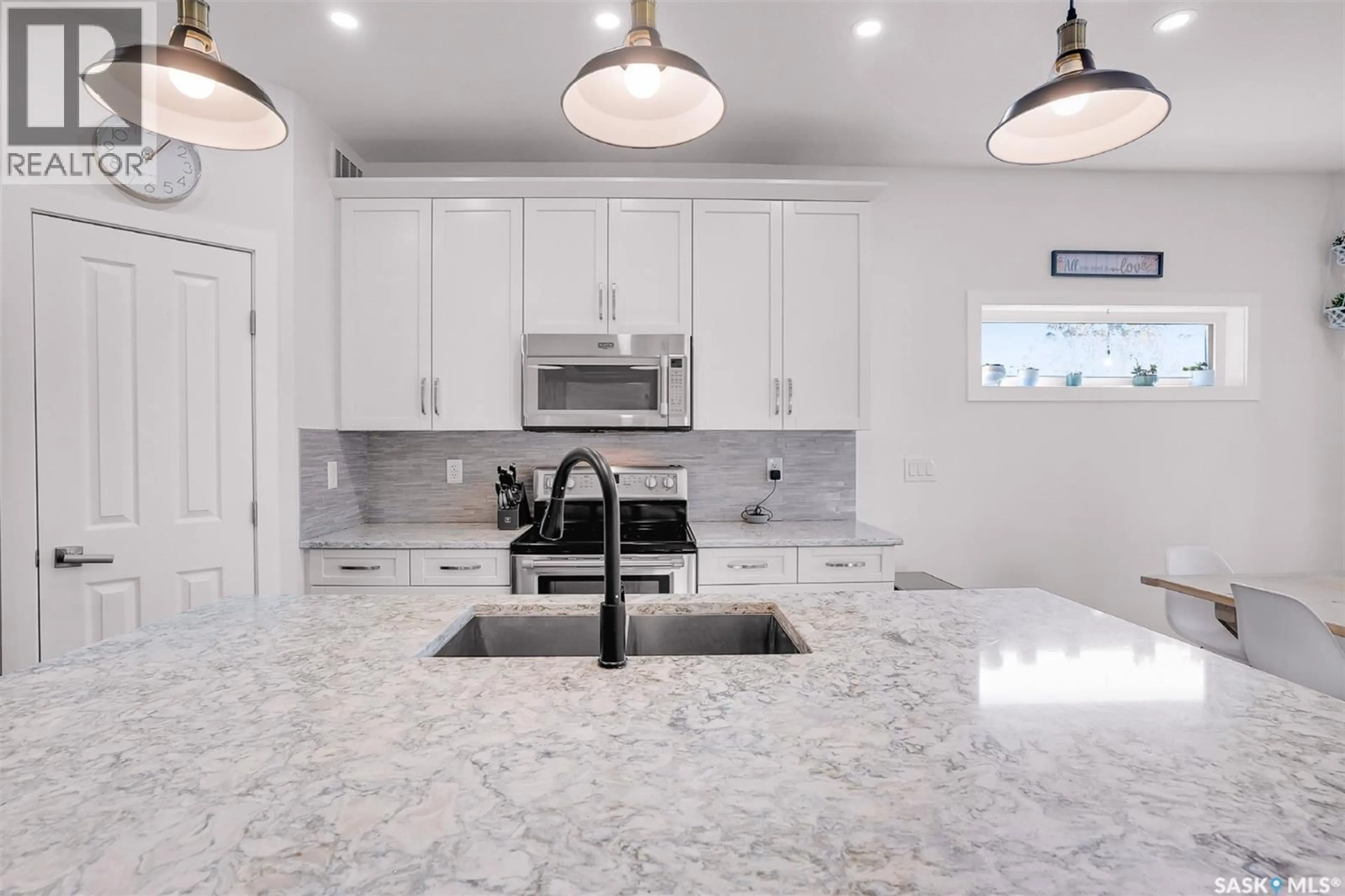 Open concept kitchen, ceramic/tile floor for 1042 GLACIAL SHORES COMMON, Saskatoon Saskatchewan S7W0R3