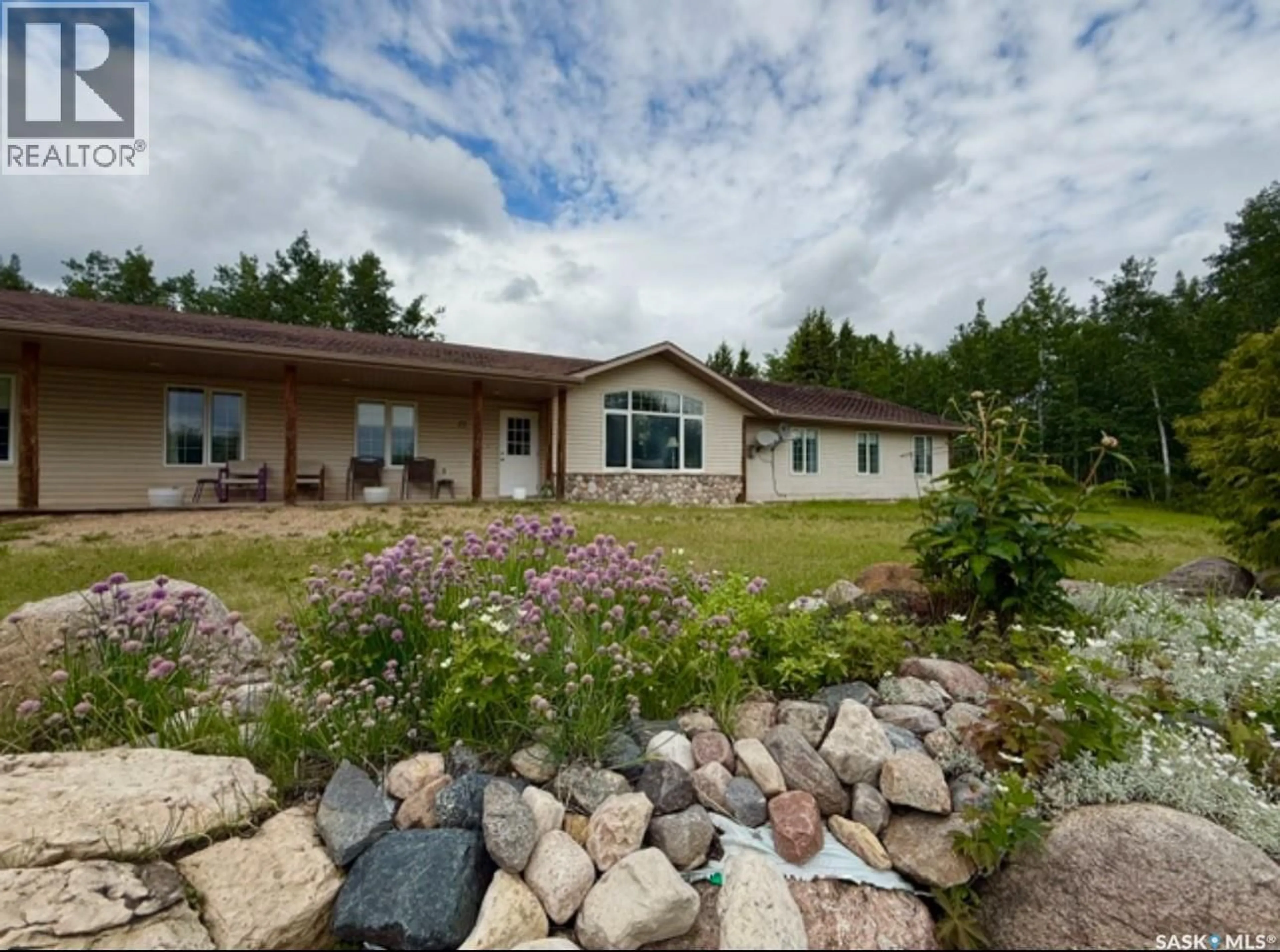 A pic from outside/outdoor area/front of a property/back of a property/a pic from drone, unknown for 25 SOUTHRIDGE DRIVE, Christopher Lake Saskatchewan S0J0N0