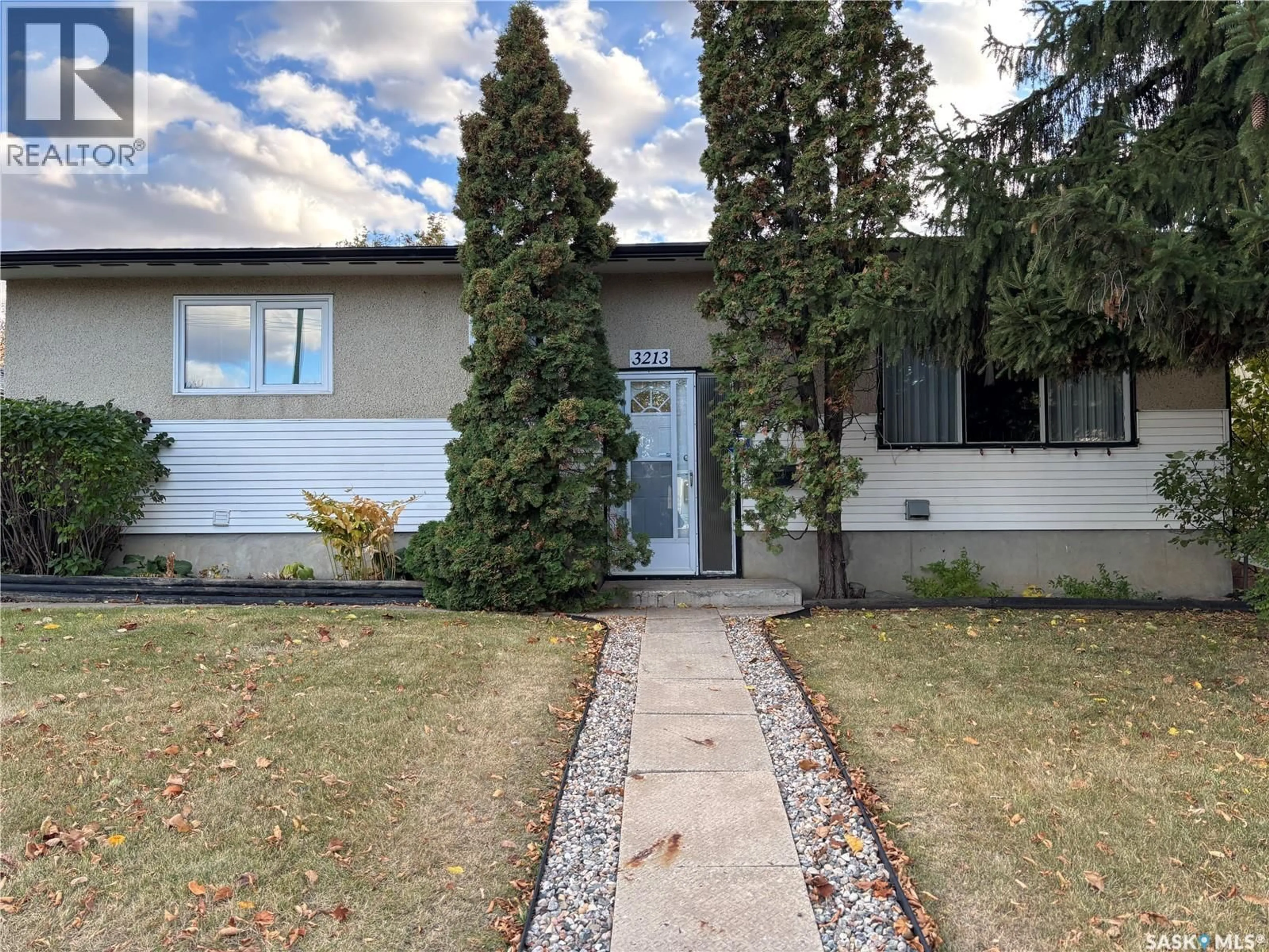Home with vinyl exterior material, street for 3213 33RD STREET, Saskatoon Saskatchewan S7L4R1