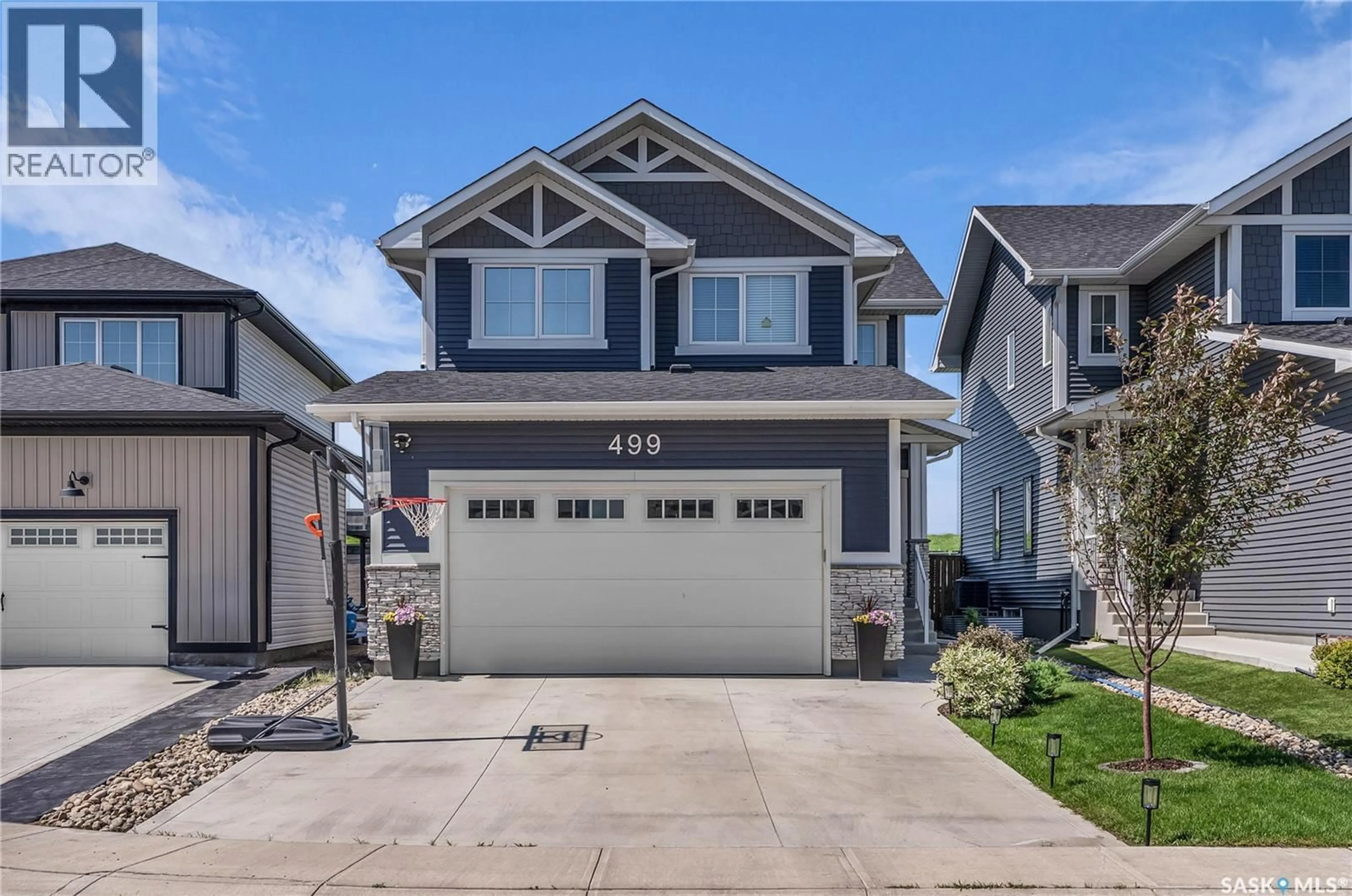 Home with vinyl exterior material, street for 499 MCFAULL CRESCENT, Saskatoon Saskatchewan S7V0T1