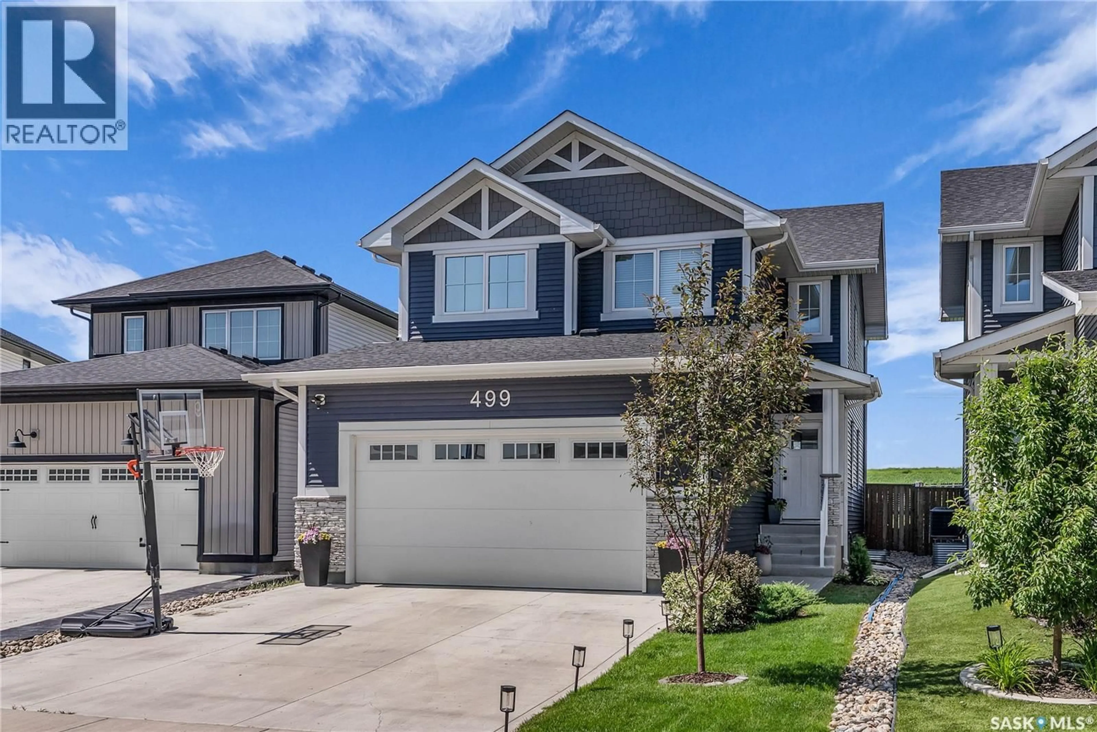 Home with vinyl exterior material, street for 499 MCFAULL CRESCENT, Saskatoon Saskatchewan S7V0T1