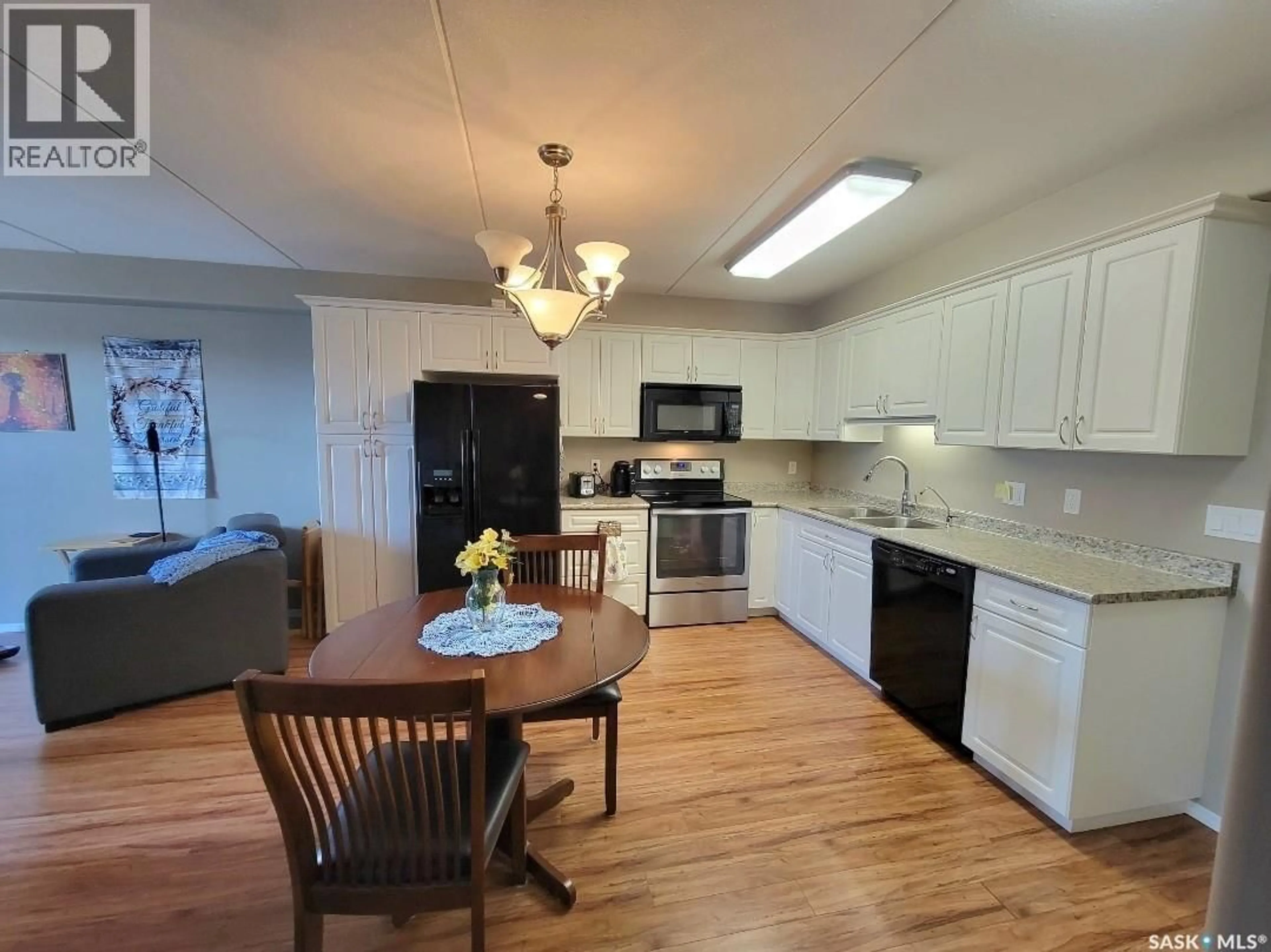 Open concept kitchen, wood/laminate floor for 201 2 18TH STREET, Battleford Saskatchewan S0M0E0