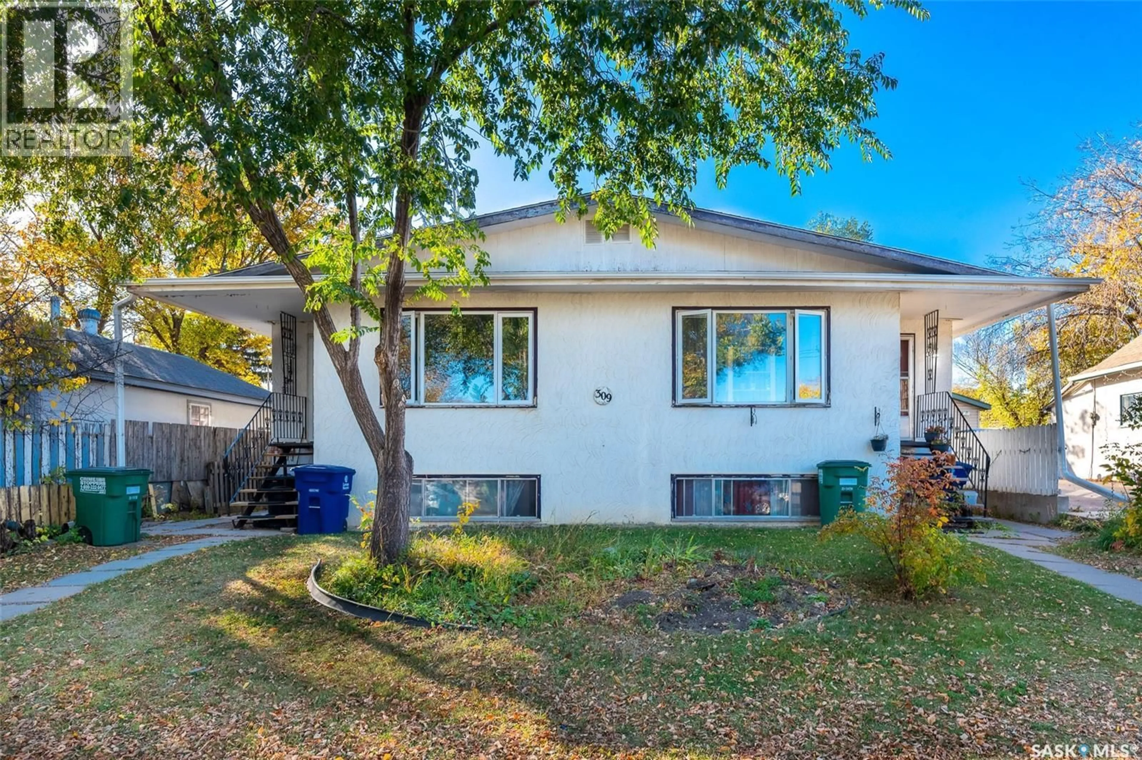Home with vinyl exterior material, street for 309 / 311 Y AVENUE, Saskatoon Saskatchewan S7M3J6