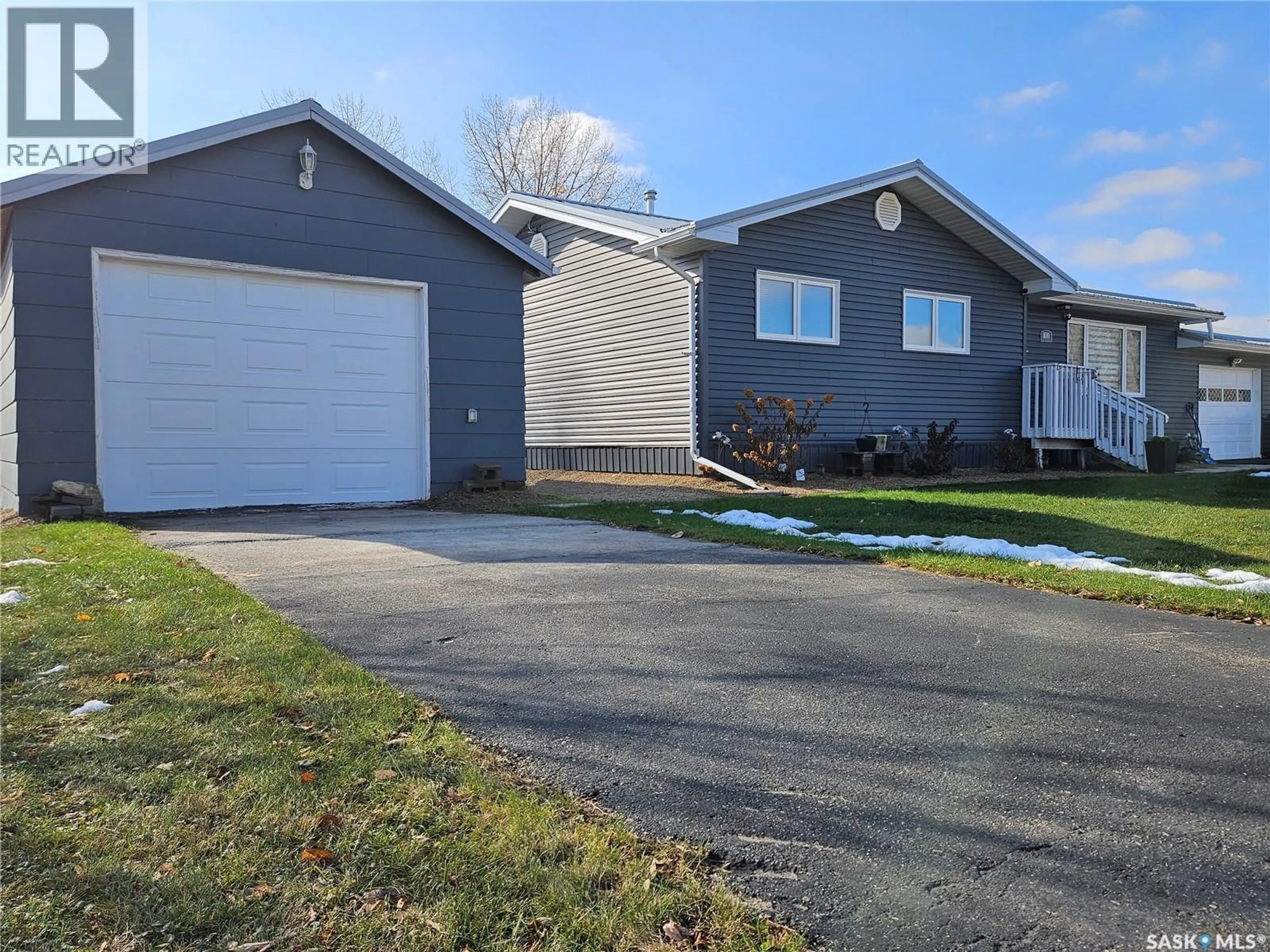 Home with vinyl exterior material, street for 1010 101ST AVENUE, Tisdale Saskatchewan S0E1T0