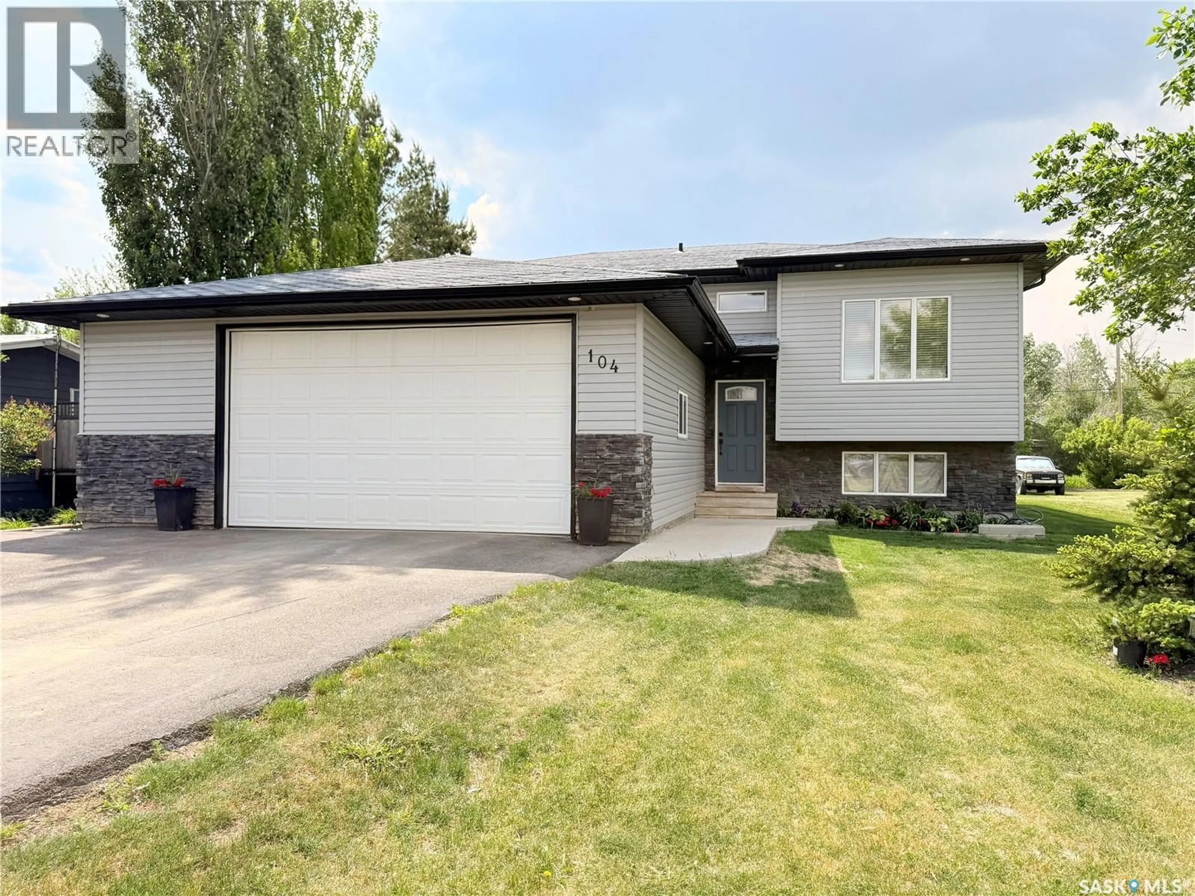 Home with vinyl exterior material, street for 104 4TH STREET, Milden Saskatchewan S0L2L0