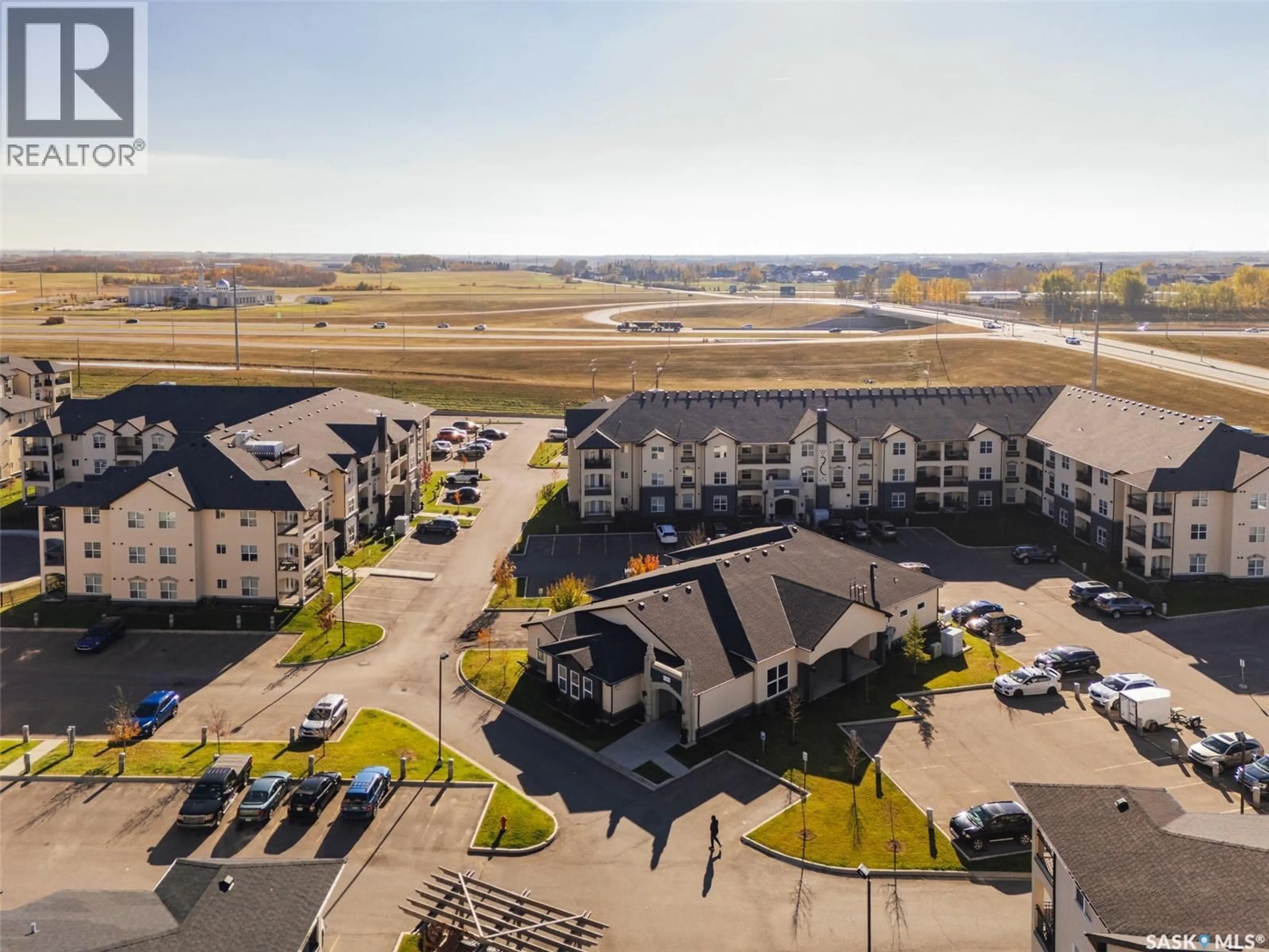 A pic from outside/outdoor area/front of a property/back of a property/a pic from drone, unknown for 110 - 306 PHELPS WAY, Saskatoon Saskatchewan S7V0K5