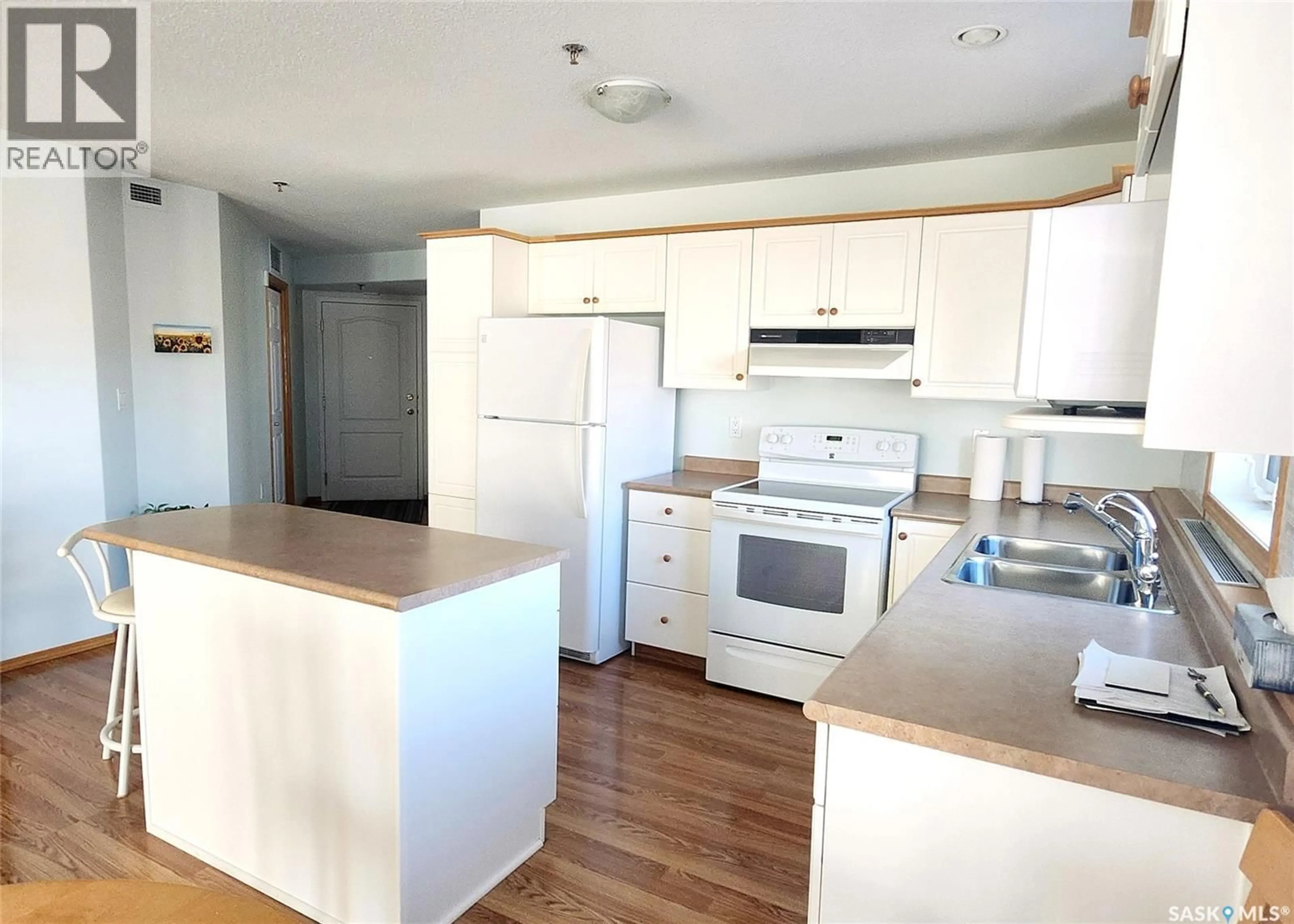 Standard kitchen, wood/laminate floor for 302 205 MCINTYRE STREET N, Regina Saskatchewan S4R3B7