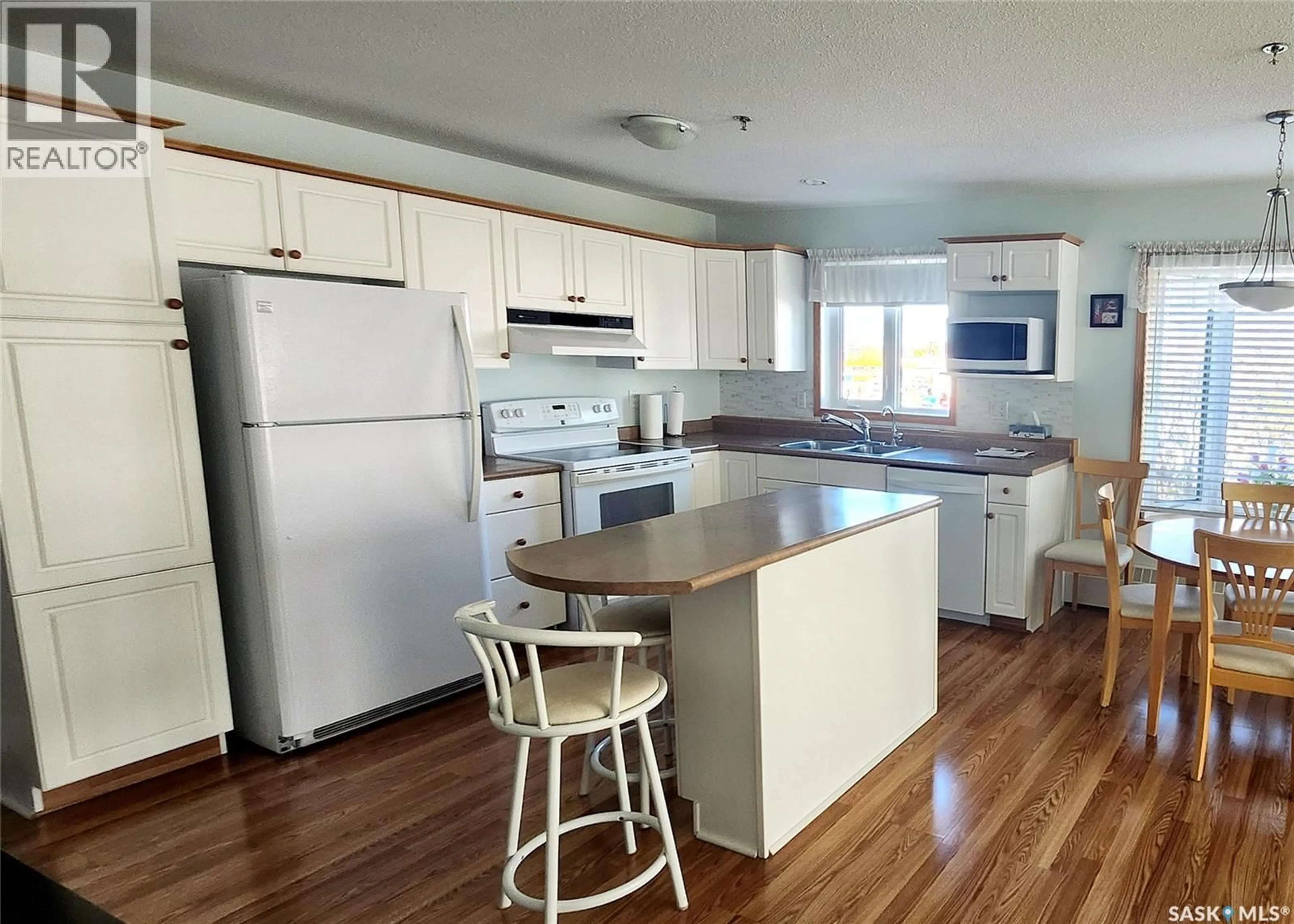 Standard kitchen, wood/laminate floor for 302 205 MCINTYRE STREET N, Regina Saskatchewan S4R3B7